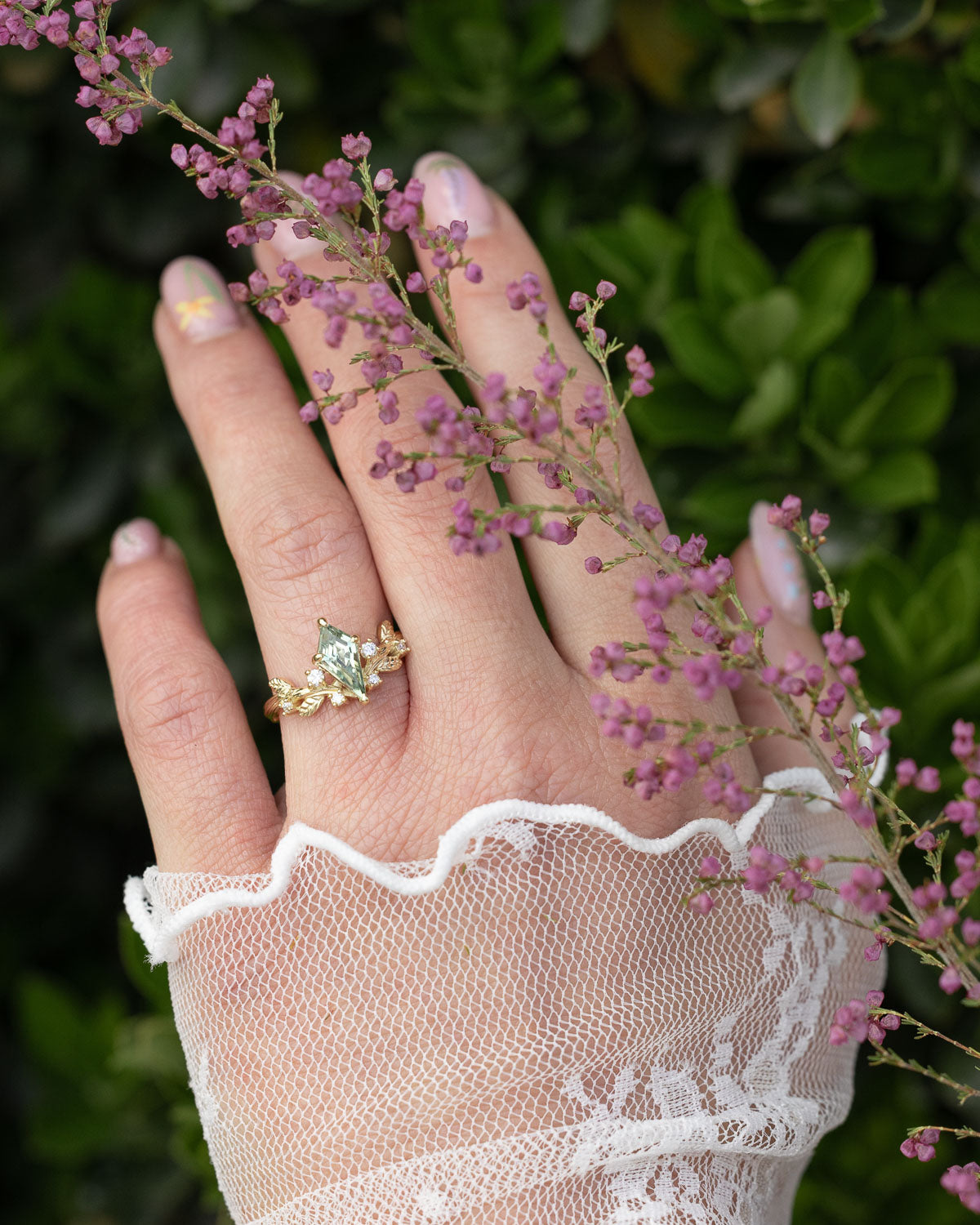 On hand photo of "Artemisia" - antler/branch-style lab-grown sapphire women's engagement ring with diamond accents