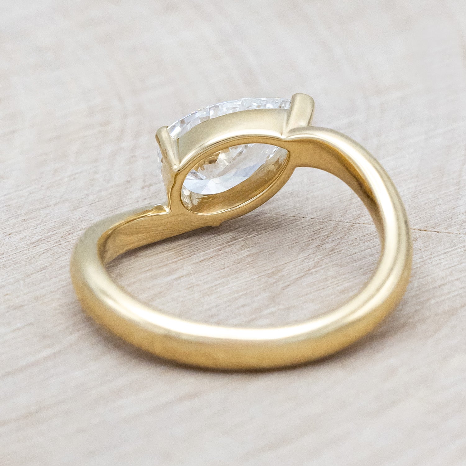 Back view of "Sybil" - asymmetrical solitaire-style lab diamond women's engagement ring