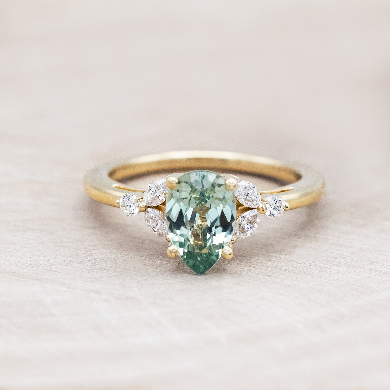 "Blossom" - pear cut lab-grown green sapphire women's engagement ring with diamond accents