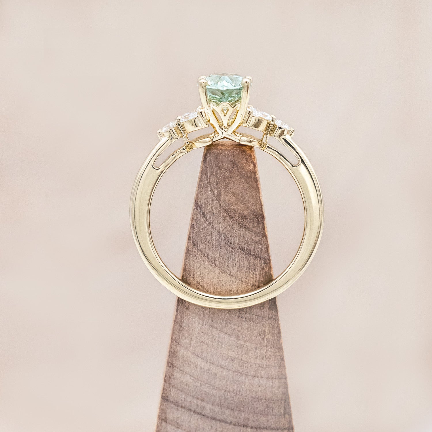 Top view of "Blossom" - pear cut lab-grown green sapphire women's engagement ring with diamond accents