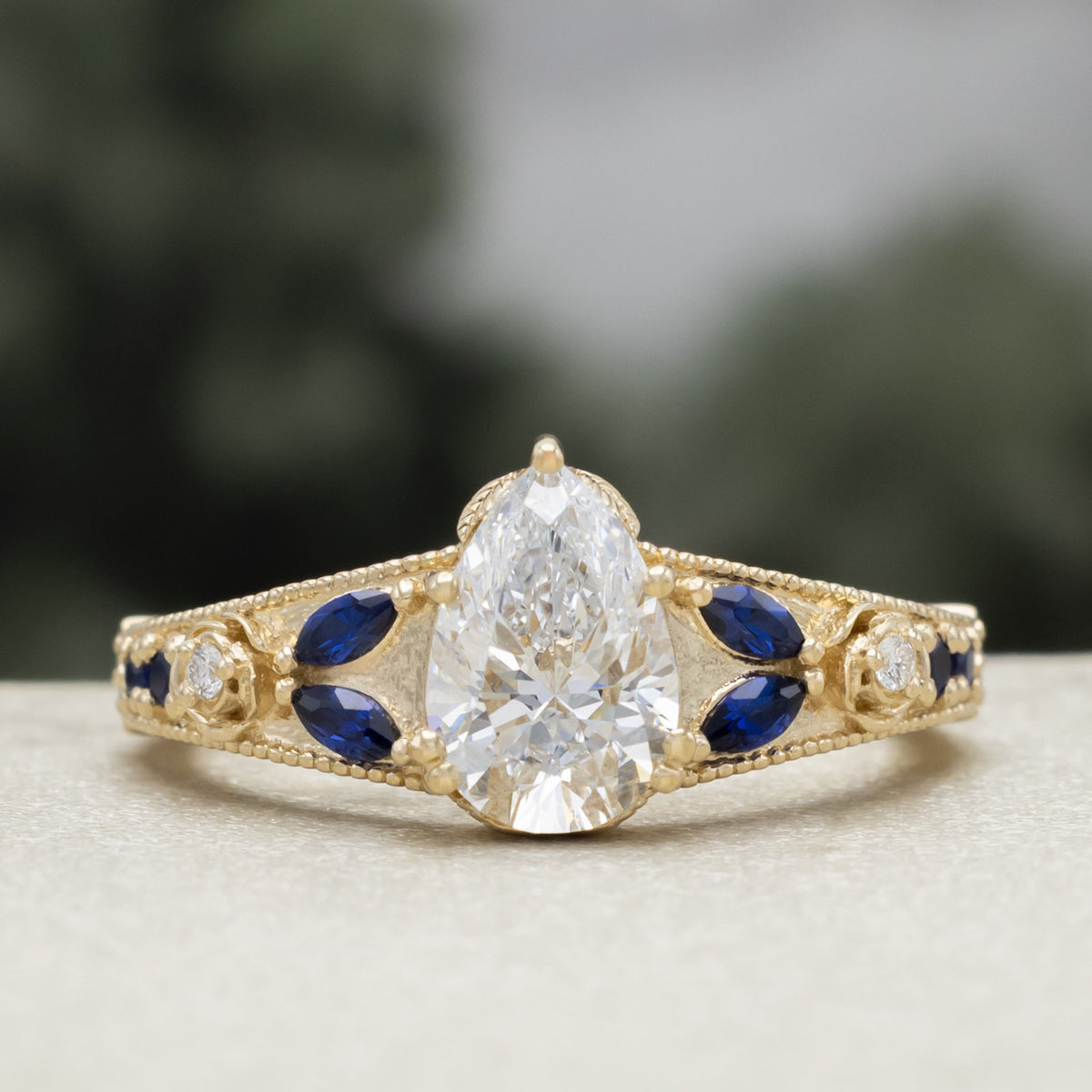 "Iris" - Lab-Grown Pear Cut Diamond Engagement Ring With Diamond & Lab-Grown Blue Sapphire Accents-Staghead Designs