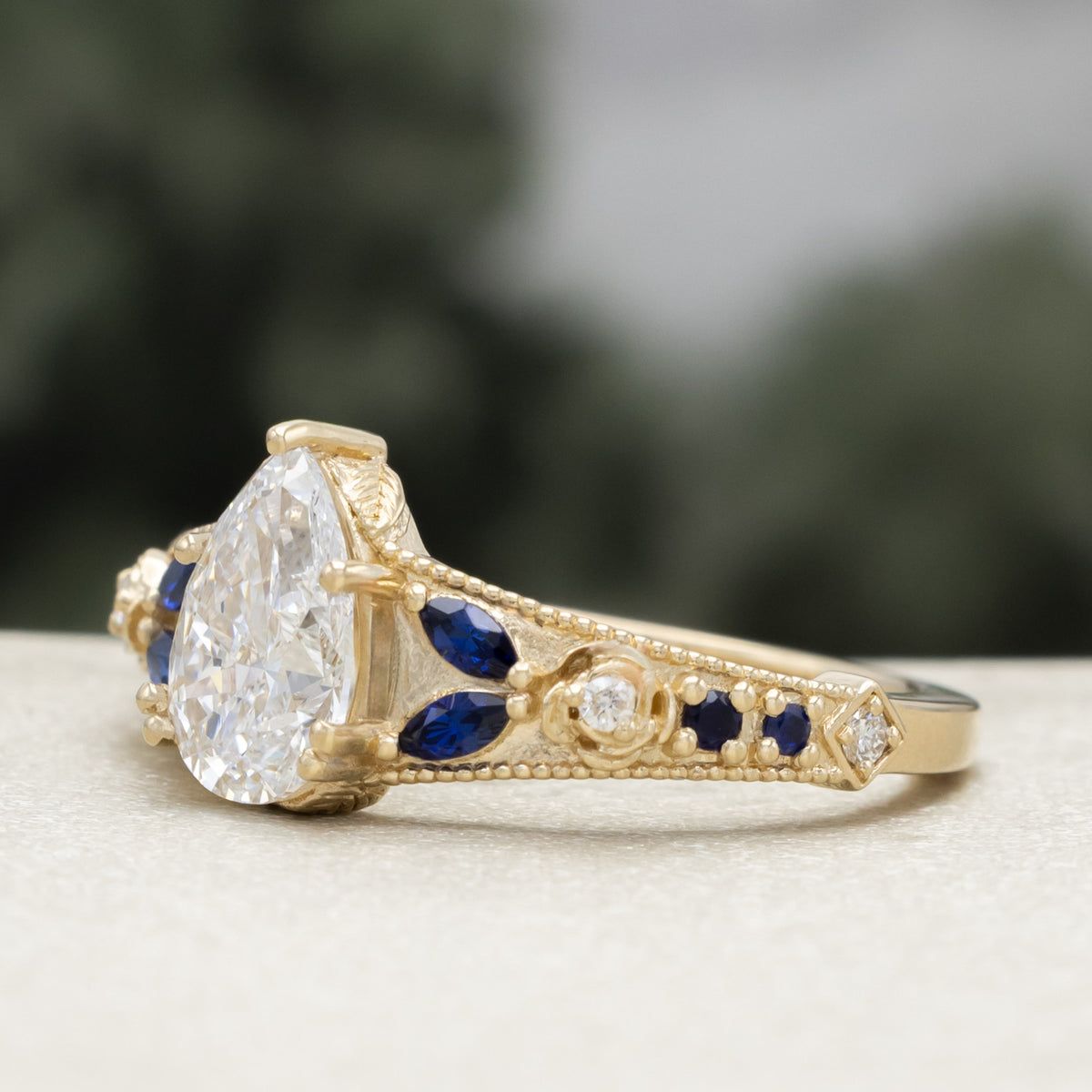 "Iris" - Lab-Grown Pear Cut Diamond Engagement Ring With Diamond & Lab-Grown Blue Sapphire Accents-Staghead Designs