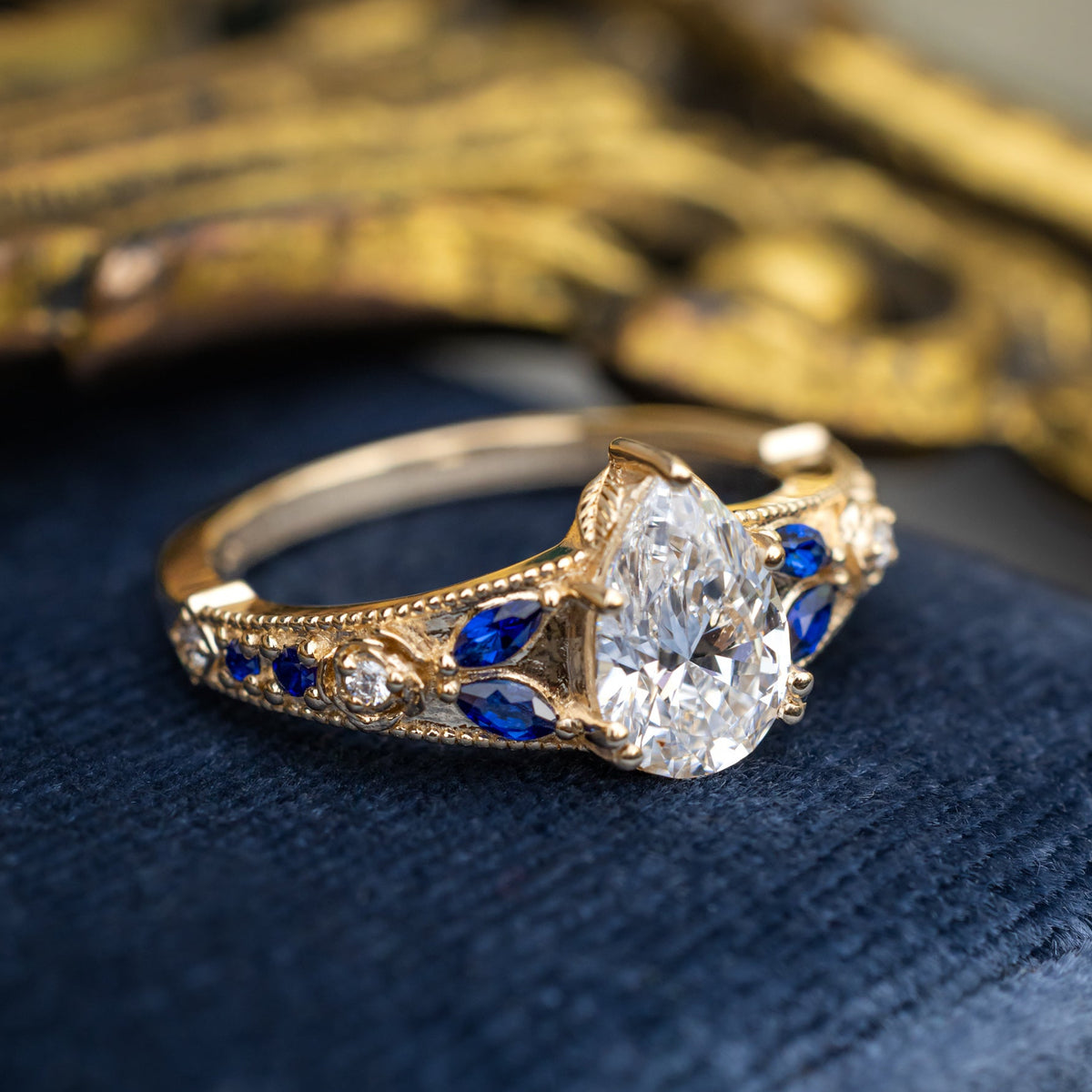 "Iris" - Lab-Grown Pear Cut Diamond Engagement Ring With Diamond & Lab-Grown Blue Sapphire Accents-Staghead Designs
