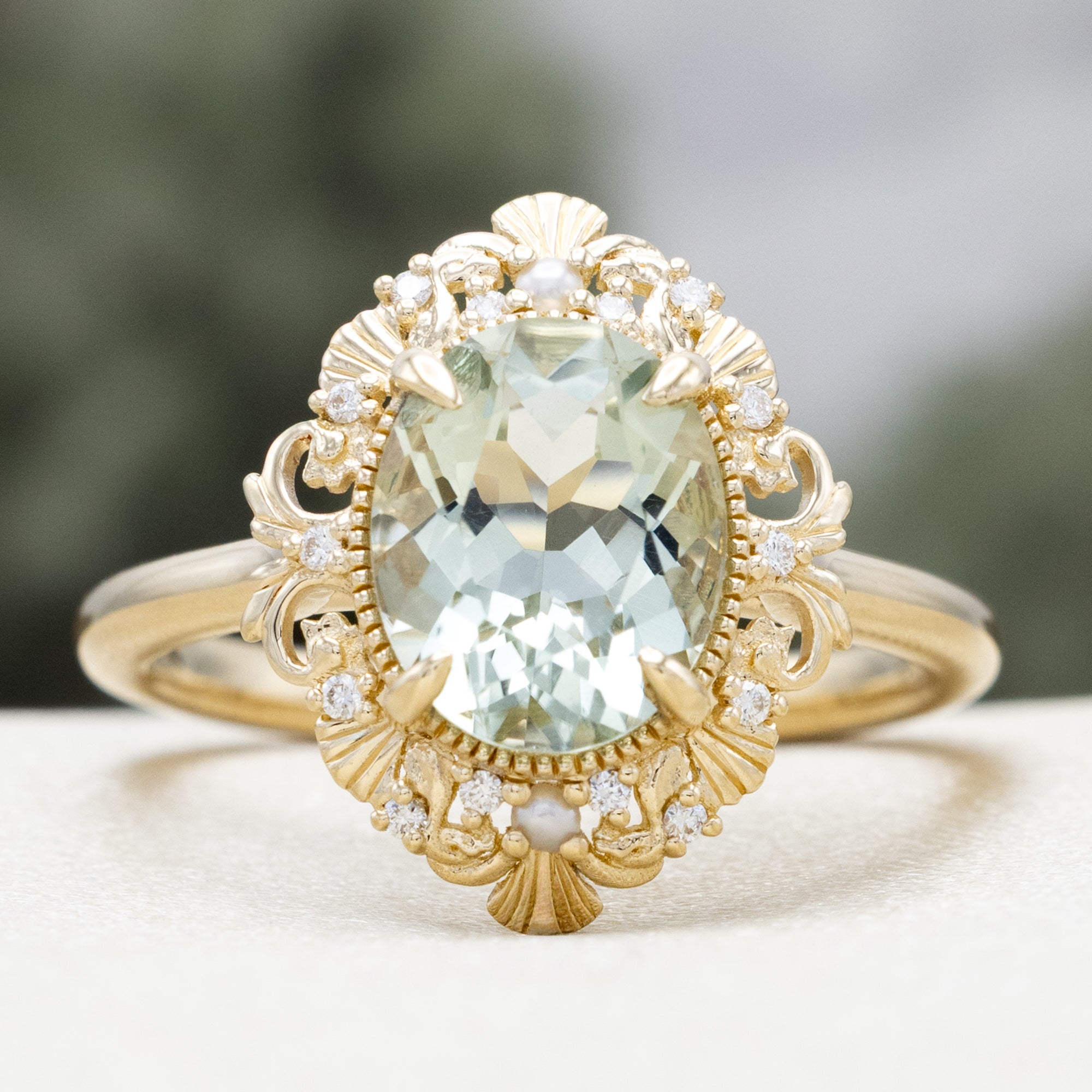 "MERROW" - OVAL CUT ENGAGEMENT RING WITH PEARL ACCENTS AND DIAMOND TRACER