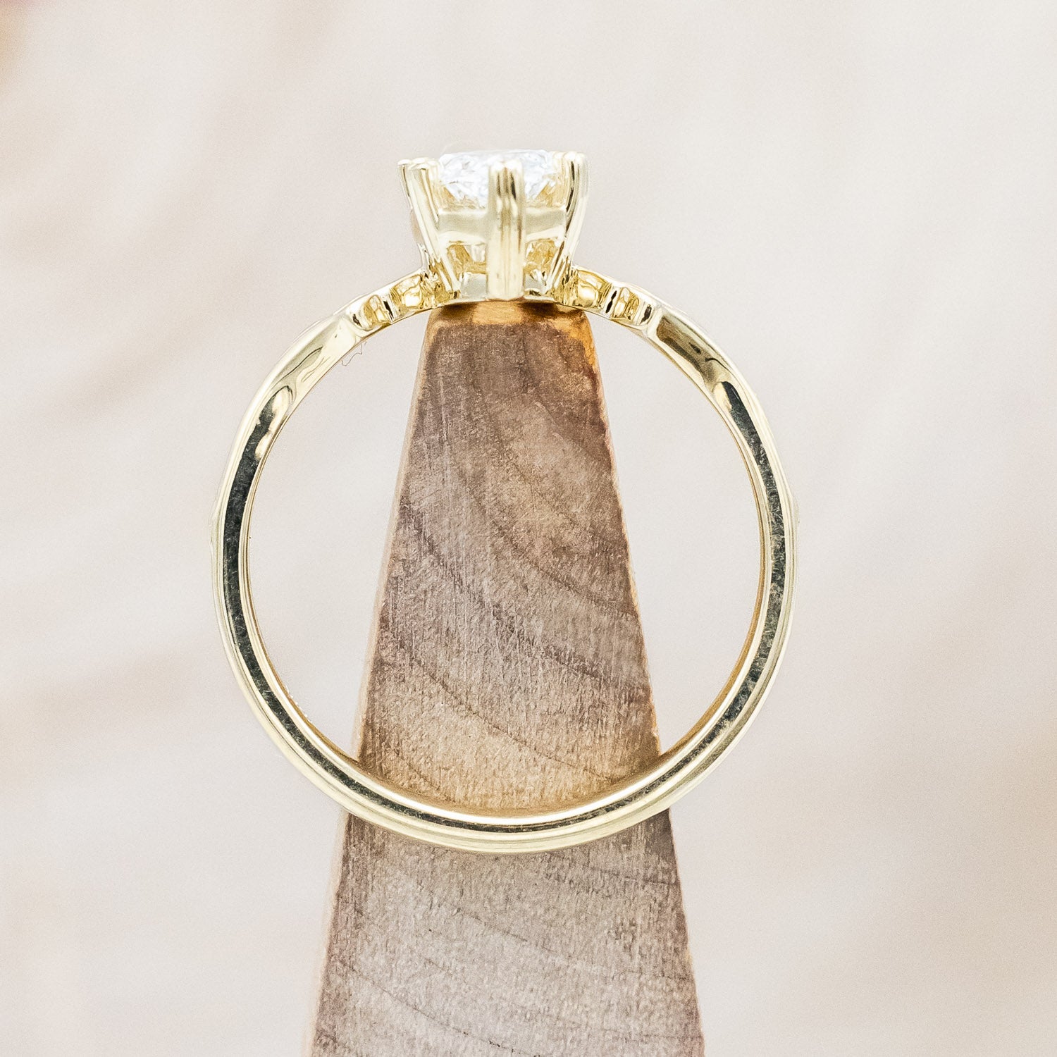 Facing up angle of "Morrigan" - ornate solitaire engagement ring with white marquise diamond