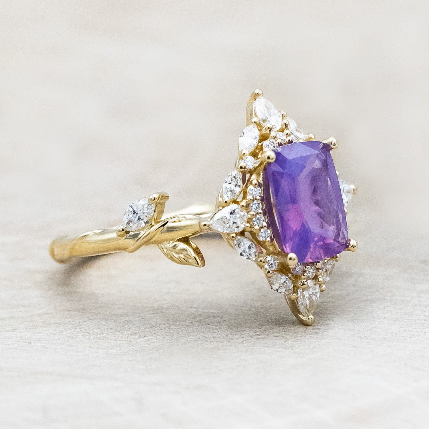 Side view of "Polaris" - women's engagement ring with a Sri Lanka opalescent sapphire, diamond halo & accents on a 14K yellow gold band.