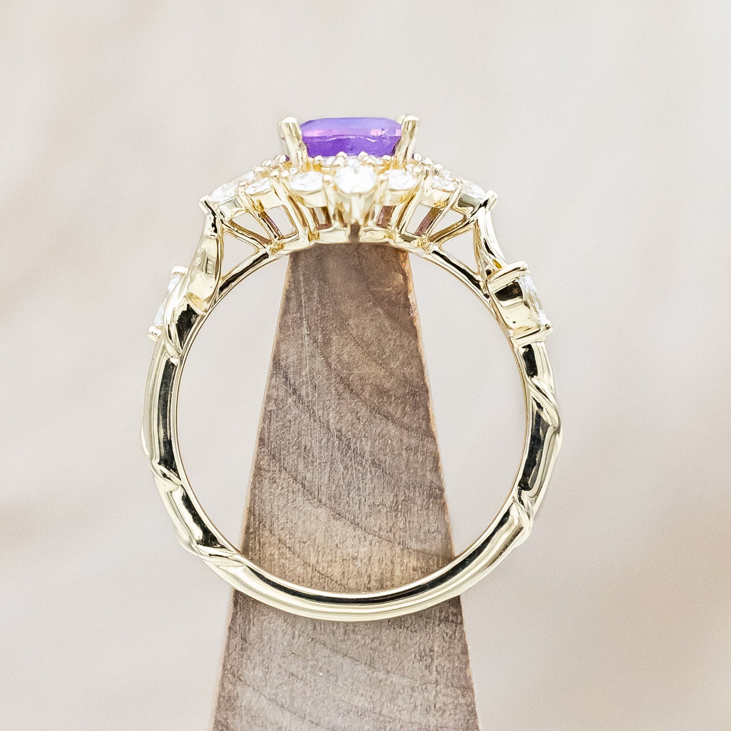 Side view of "Polaris" - women's engagement ring with a Sri Lanka opalescent sapphire, diamond halo & accents on a 14K yellow gold band.