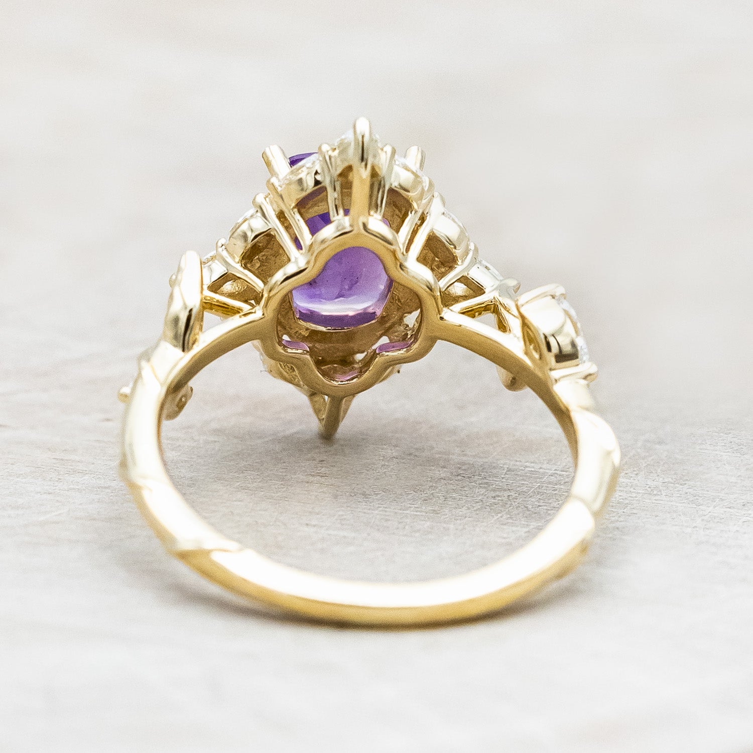 Back view of "Polaris" - women's engagement ring with a Sri Lanka opalescent sapphire, diamond halo & accents on a 14K yellow gold band.