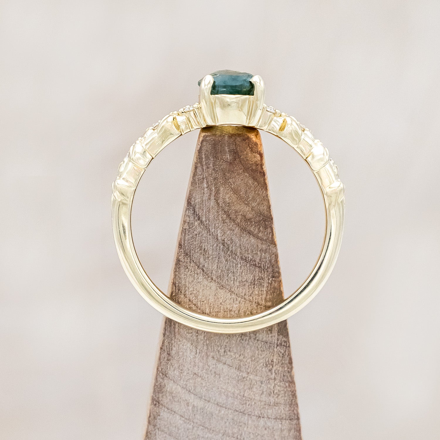 Top view of "Lynette" - pear cut moss agate women's engagement ring with diamond accents on leaf band