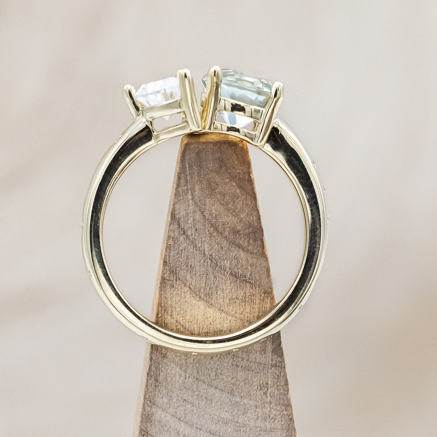 Side view of "Sidra" - toi et moi round cut green prasiolite women's engagement ring with a crescent moon moissanite accent