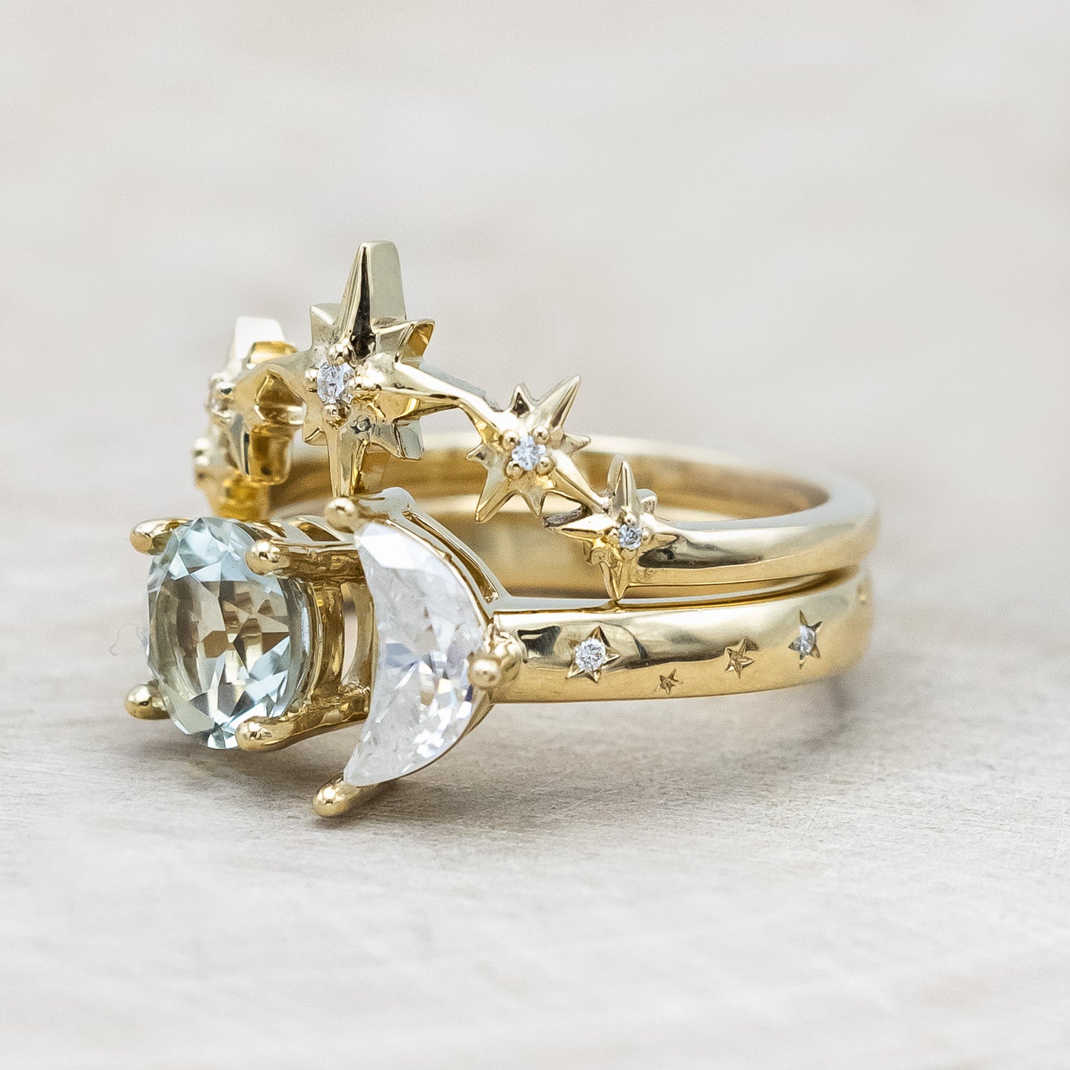 Side view of "Sidra" - toi et moi round cut green prasiolite women's engagement ring with a crescent moon moissanite accent, and celestial style diamond tracer