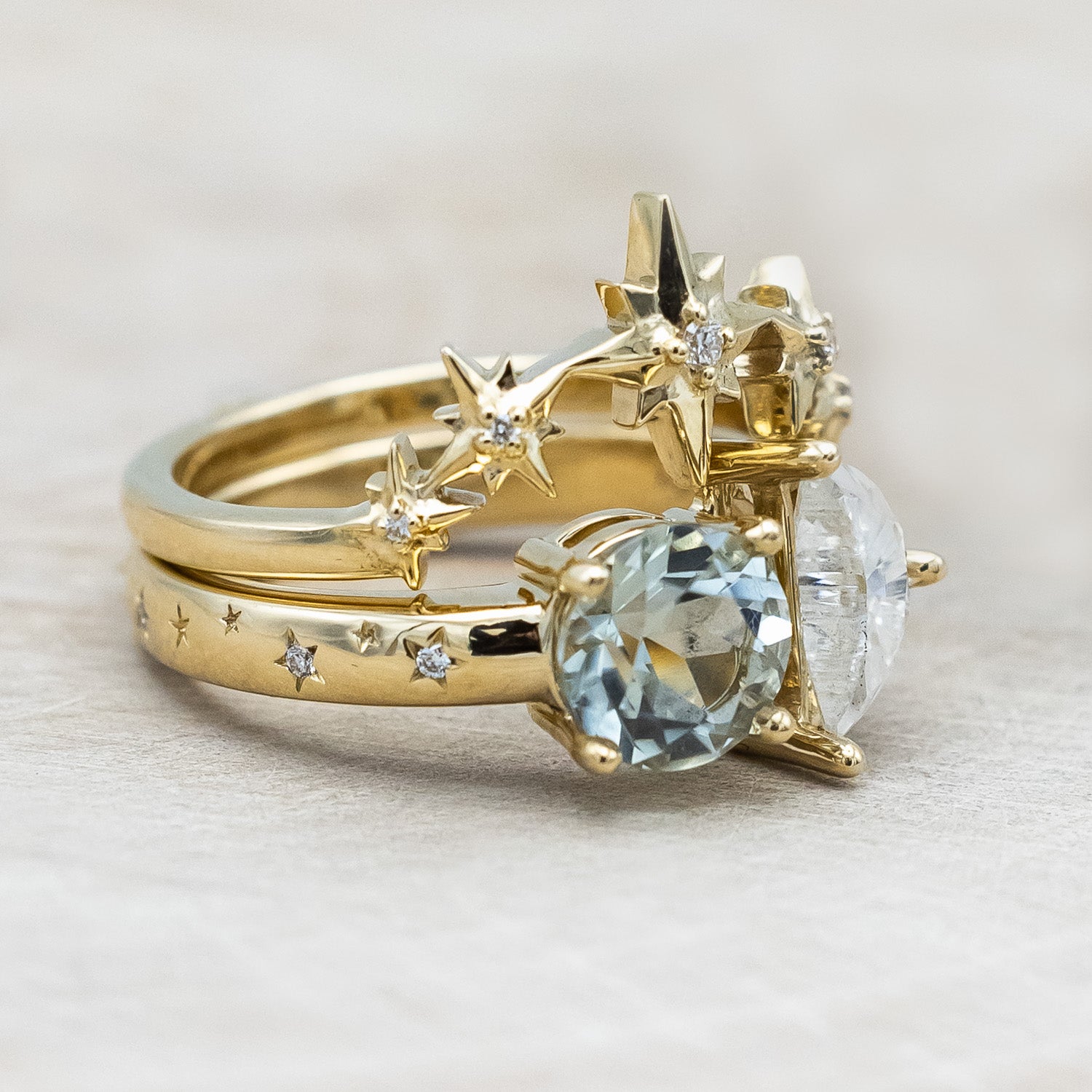 Side view of "Sidra" - toi et moi round cut green prasiolite women's engagement ring with a crescent moon moissanite accent, and celestial style diamond tracer