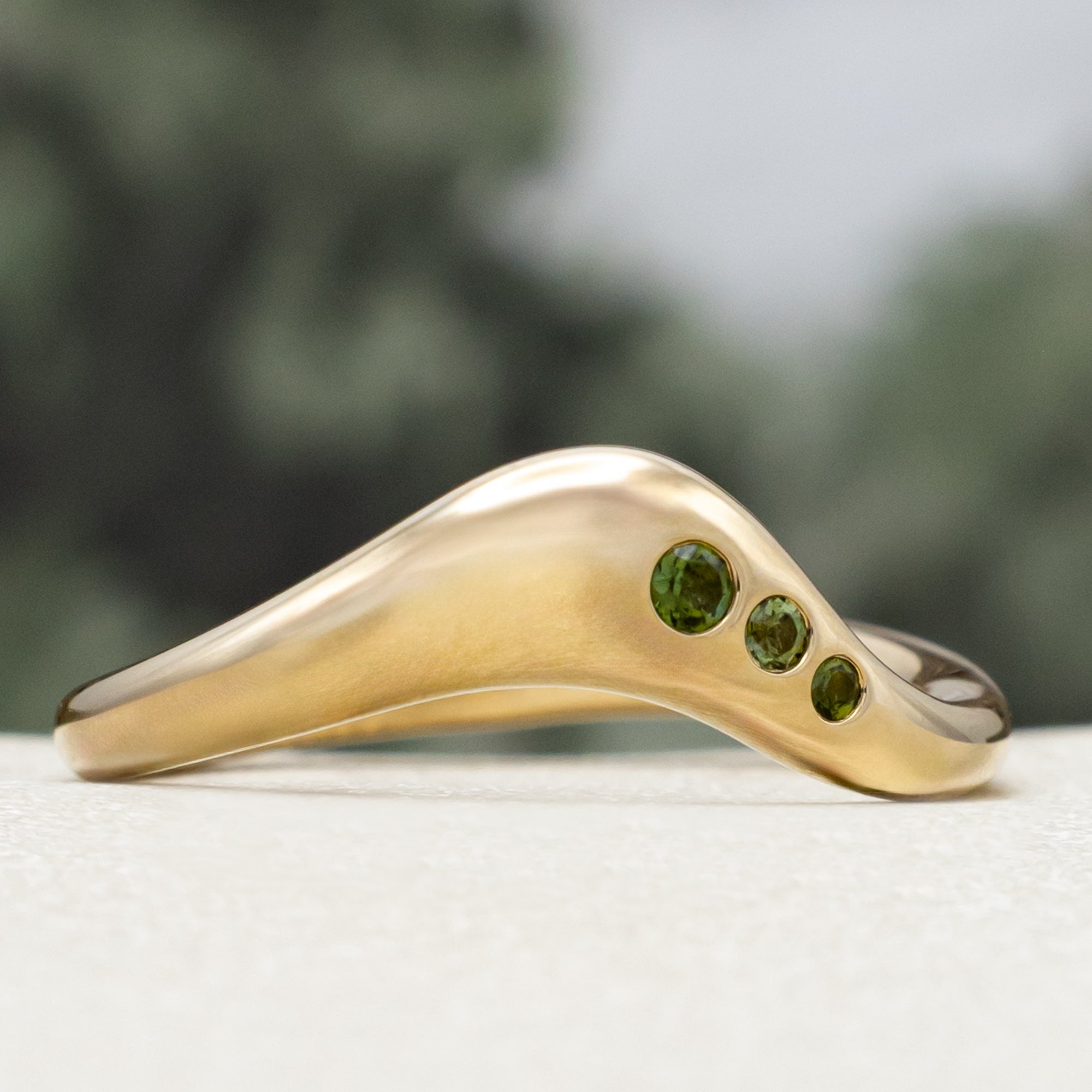 "SYBIL" - PEAR CUT MOISSANITE ASYMMETRICAL ENGAGEMENT RING WITH A GREEN TOURMALINE ACCENTED TRACER-Staghead Designs