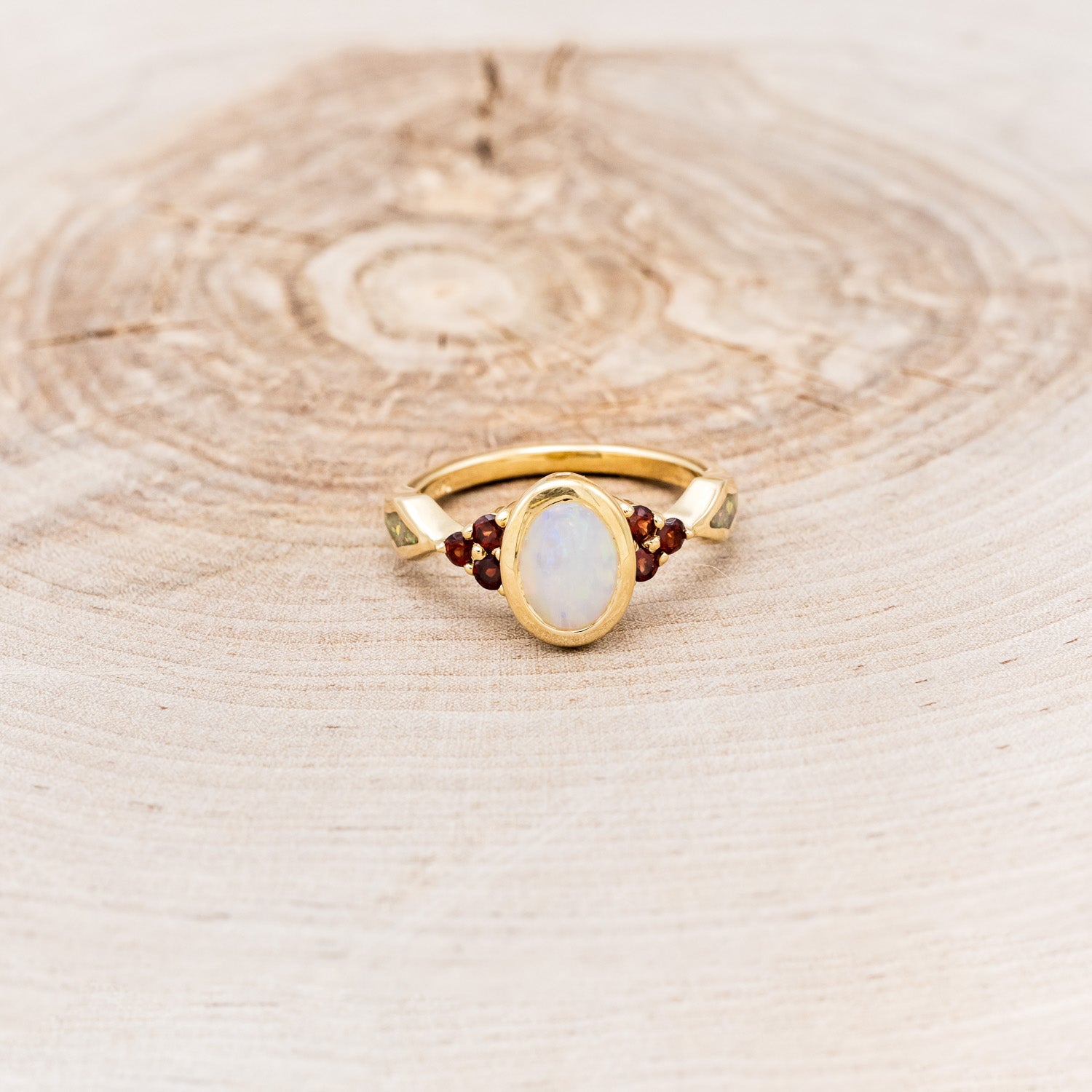 "AGATHA" - BEZEL SET OVAL CABOCHON CUT WHITE OPAL ENGAGEMENT RING WITH GARNET ACCENTS AND FIRE & ICE OPAL INLAYS-Staghead Designs