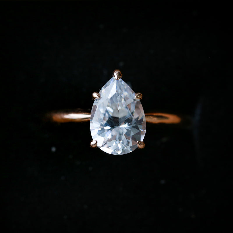 Shown here is A solitaire-style moissanite women's engagement ring with 5 prongs, delicate and ornate details and is available with many center stone options-14K GOLD 5 PRONG ENGAGEMENT RING WITH A 2ct PEAR SHAPED MOISSANITE STONE (available in 14K rose, white or yellow gold) - Staghead Designs - Antler Rings By Staghead Designs