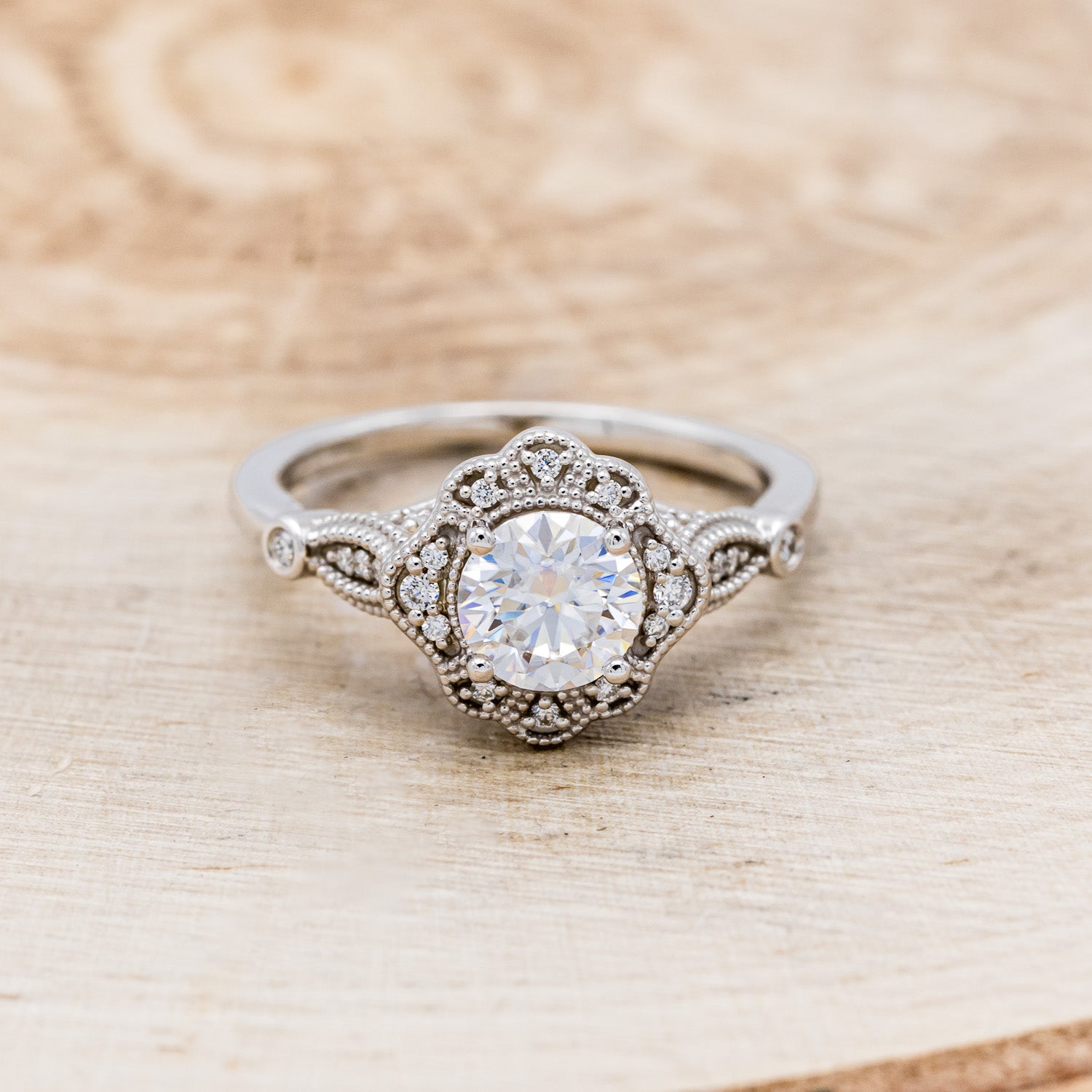 "EILEEN" - ROUND CUT MOISSANITE ENGAGEMENT RING WITH DIAMOND ACCENTS & TRACER-10