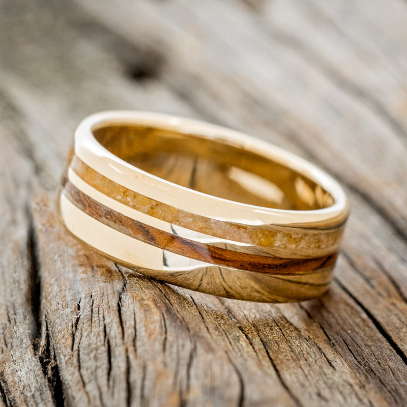 Shown here is "Cosmo", a custom, handcrafted men's wedding ring featuring two offset inlays with amber and ironwood inlays, tilted left. Additional inlay options are available upon request.