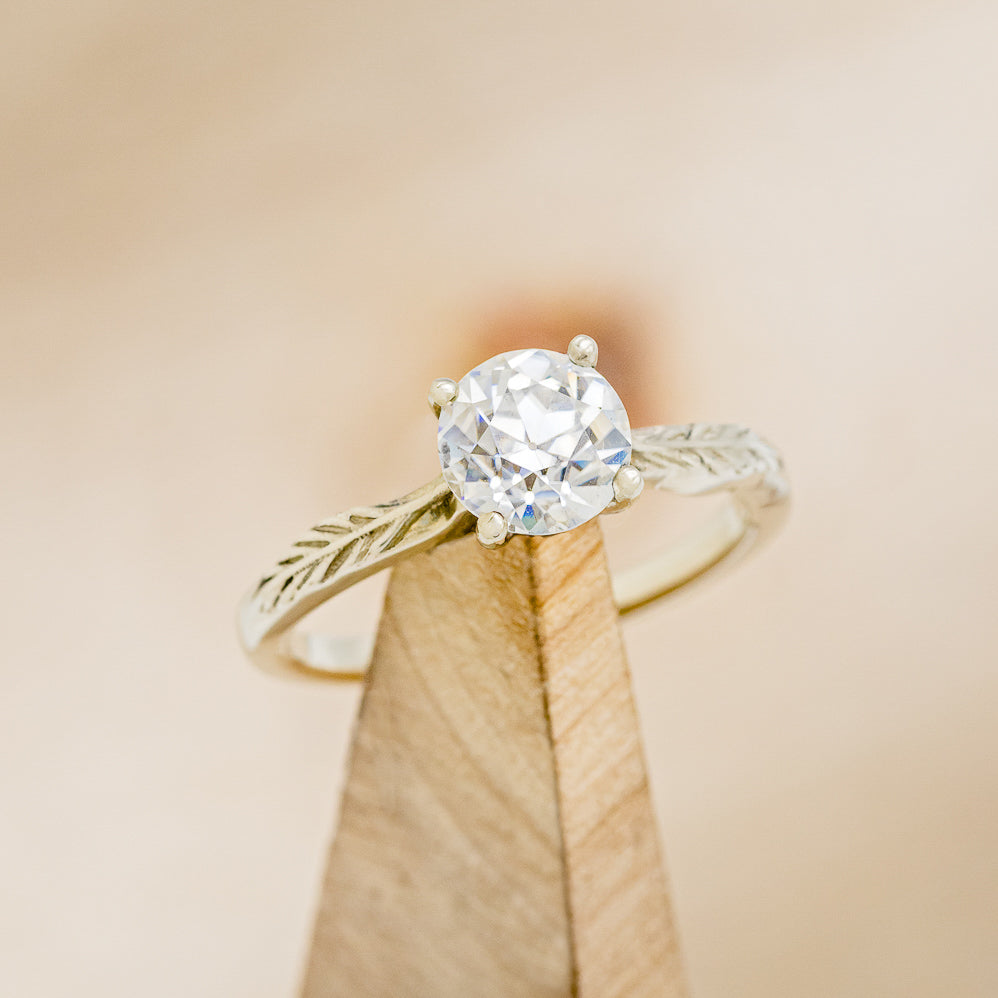 "HOPE" - ROUND CUT MOISSANITE SOLITAIRE ENGAGEMENT RING WITH FEATHER ACCENTS-7