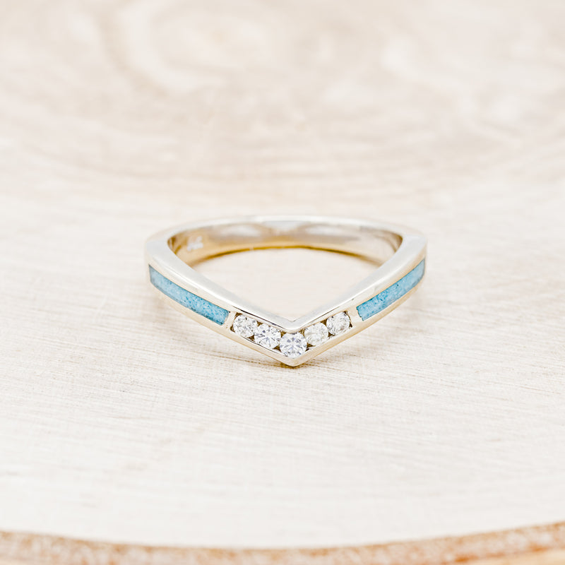 Shown here is "Kida", a custom, handcrafted women's stacking band featuring turquoise inlays and diamonds on a 14K gold band, front facing. Additional inlay options are available upon request.