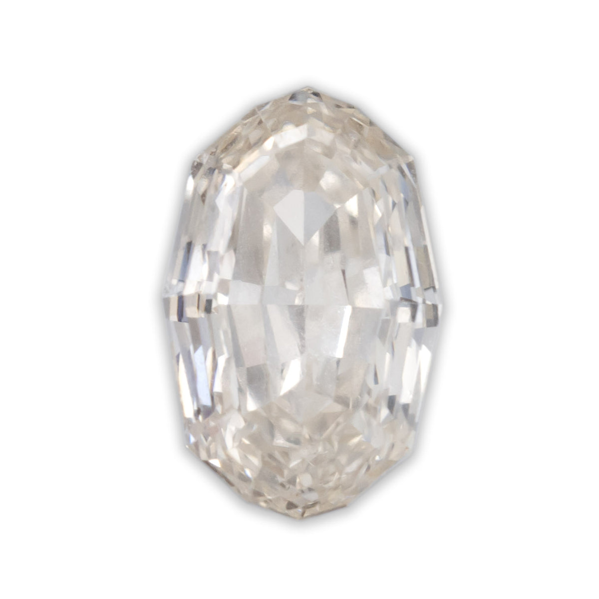 An oval cut champagne diamond on a white background