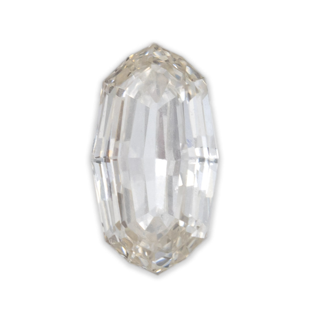 An oval cut champagne diamond on a white background