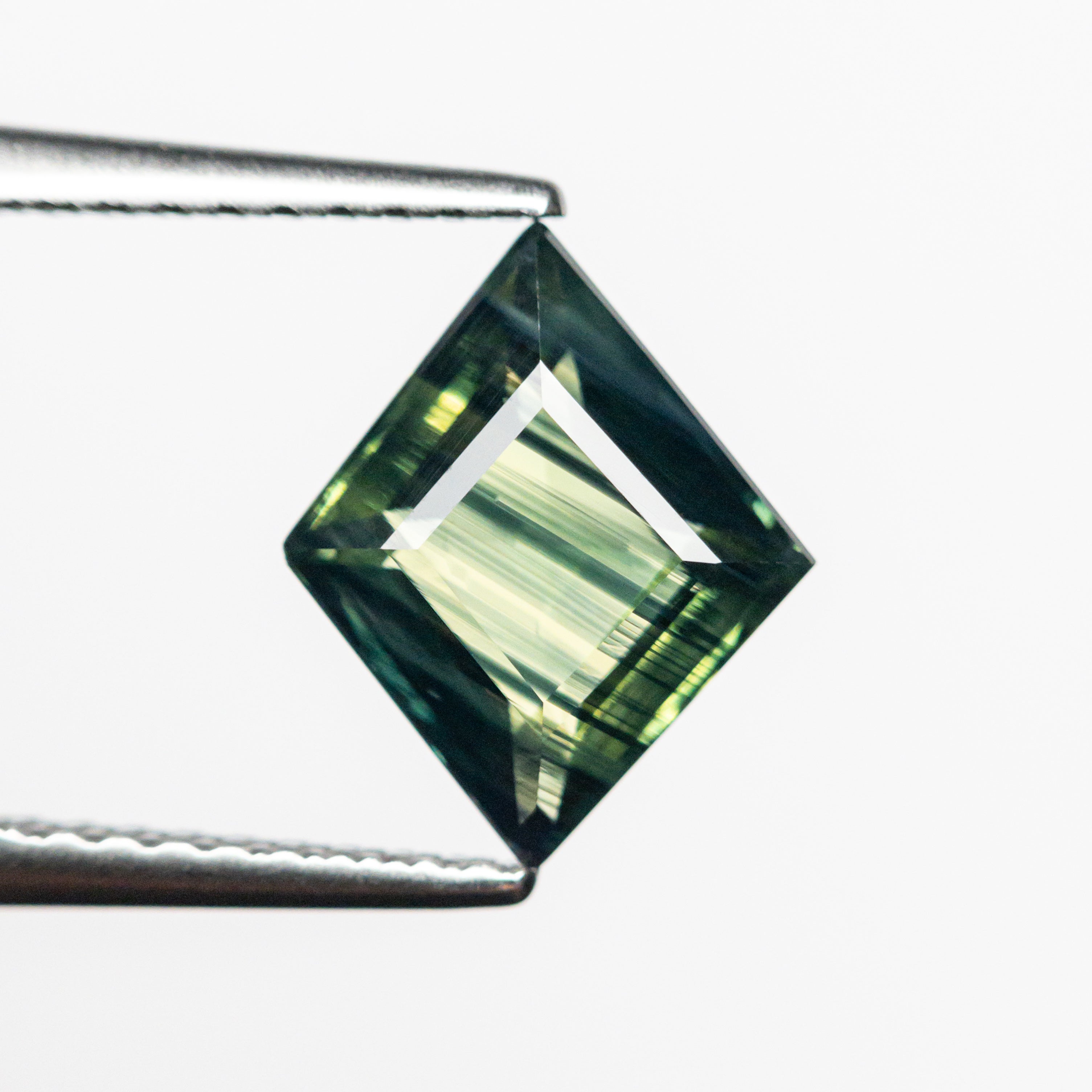 1.74ct 10.01x8.19x3.59mm Lozenge Step Cut Sapphire 23804-02-Staghead Designs