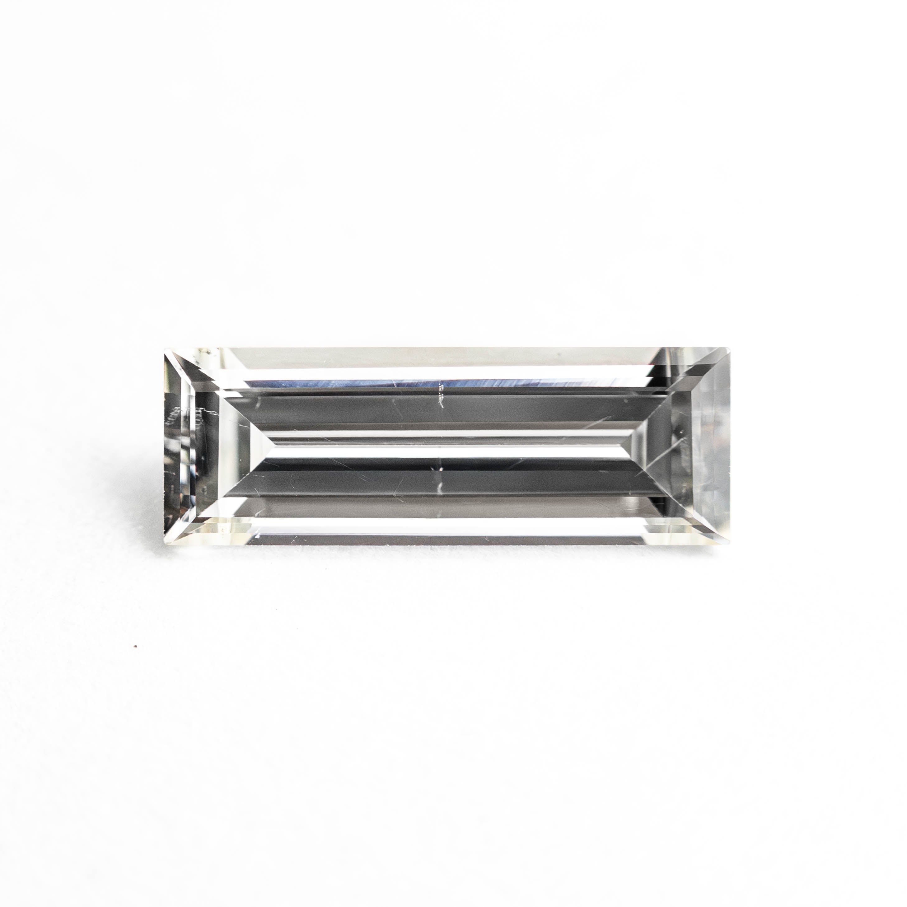 0.77ct 10.02x3.50x2.24mm SI1 J Baguette Step Cut 24699-01-Staghead Designs