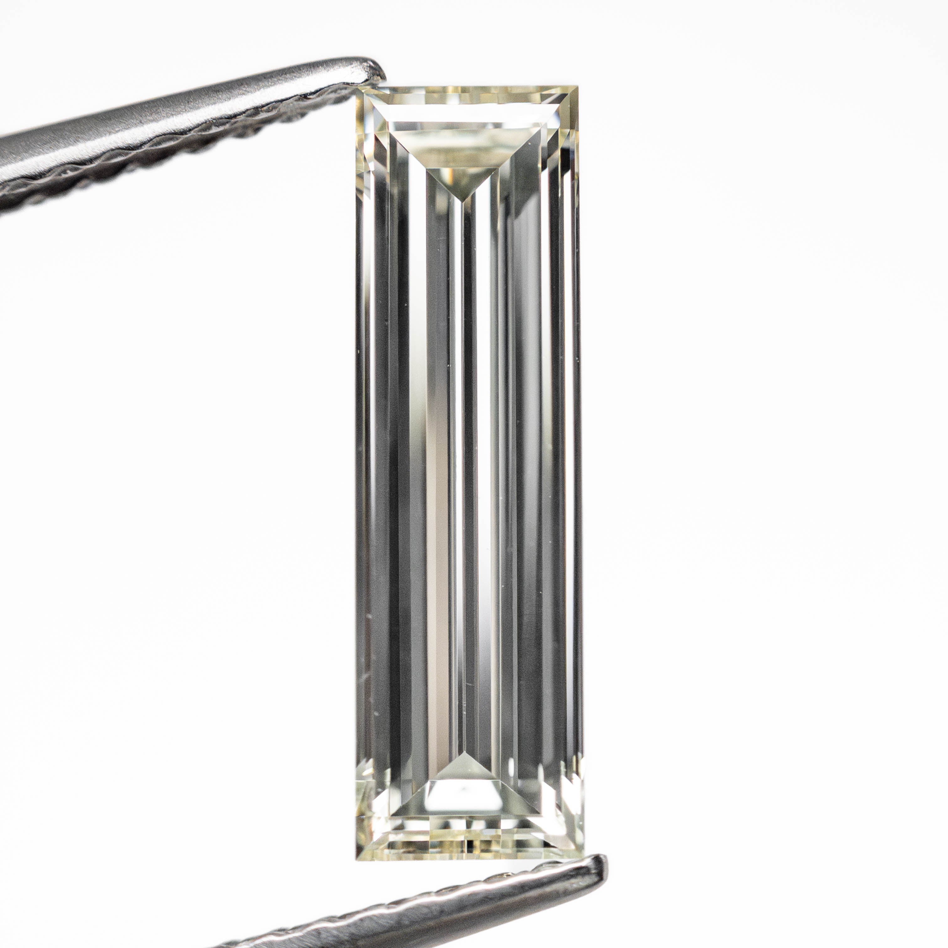 1.31ct 13.12x3.81x2.38mm VS1 L-M Baguette Step Cut 24700-01-Staghead Designs