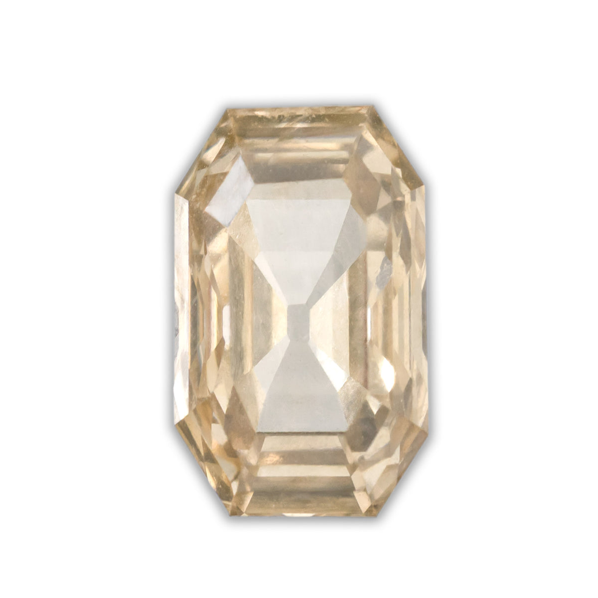A cut corner rectangle champagne diamond on a white background