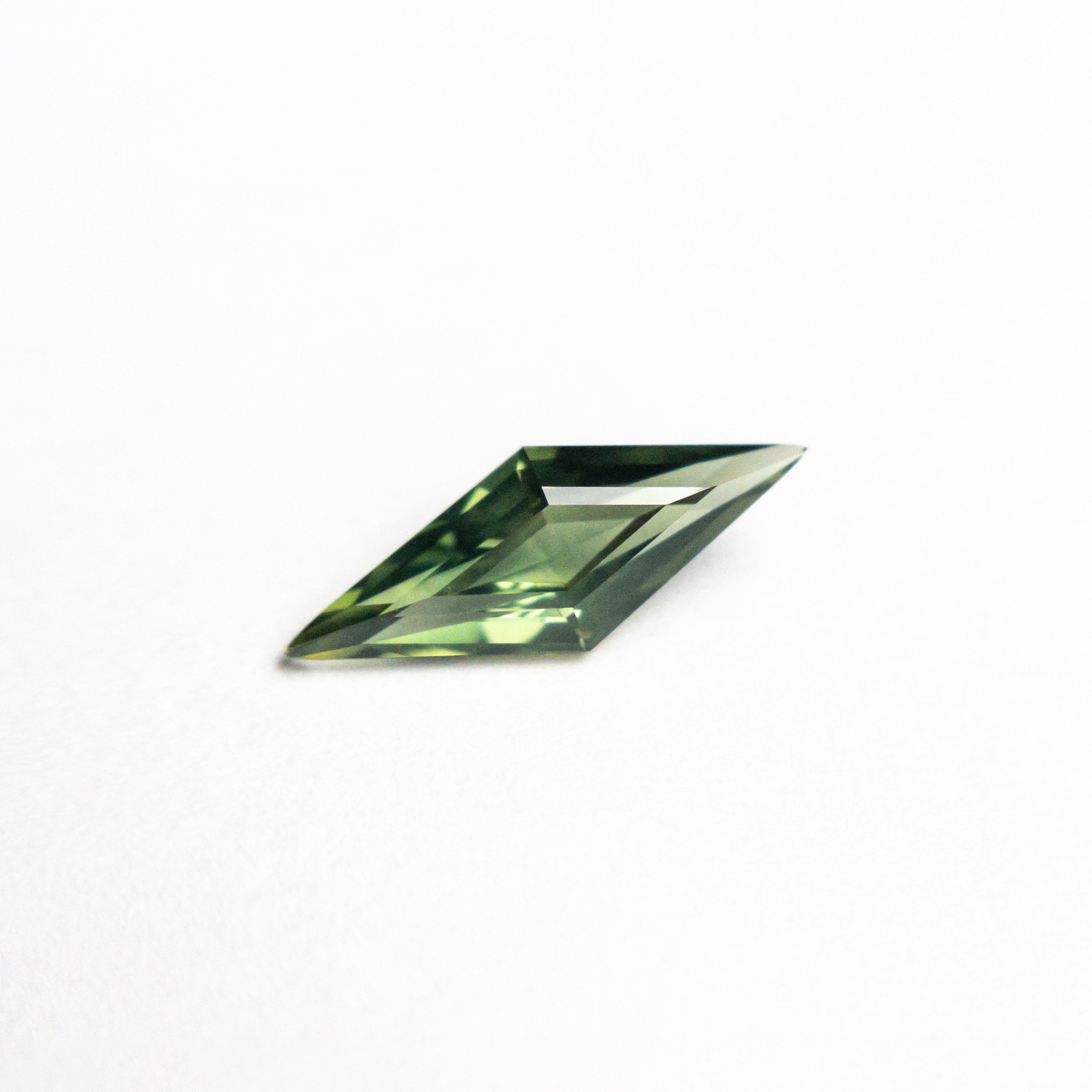 0.51ct 9.97x3.79x2.39mm Lozenge Step Cut Sapphire 25740-11-Staghead Designs