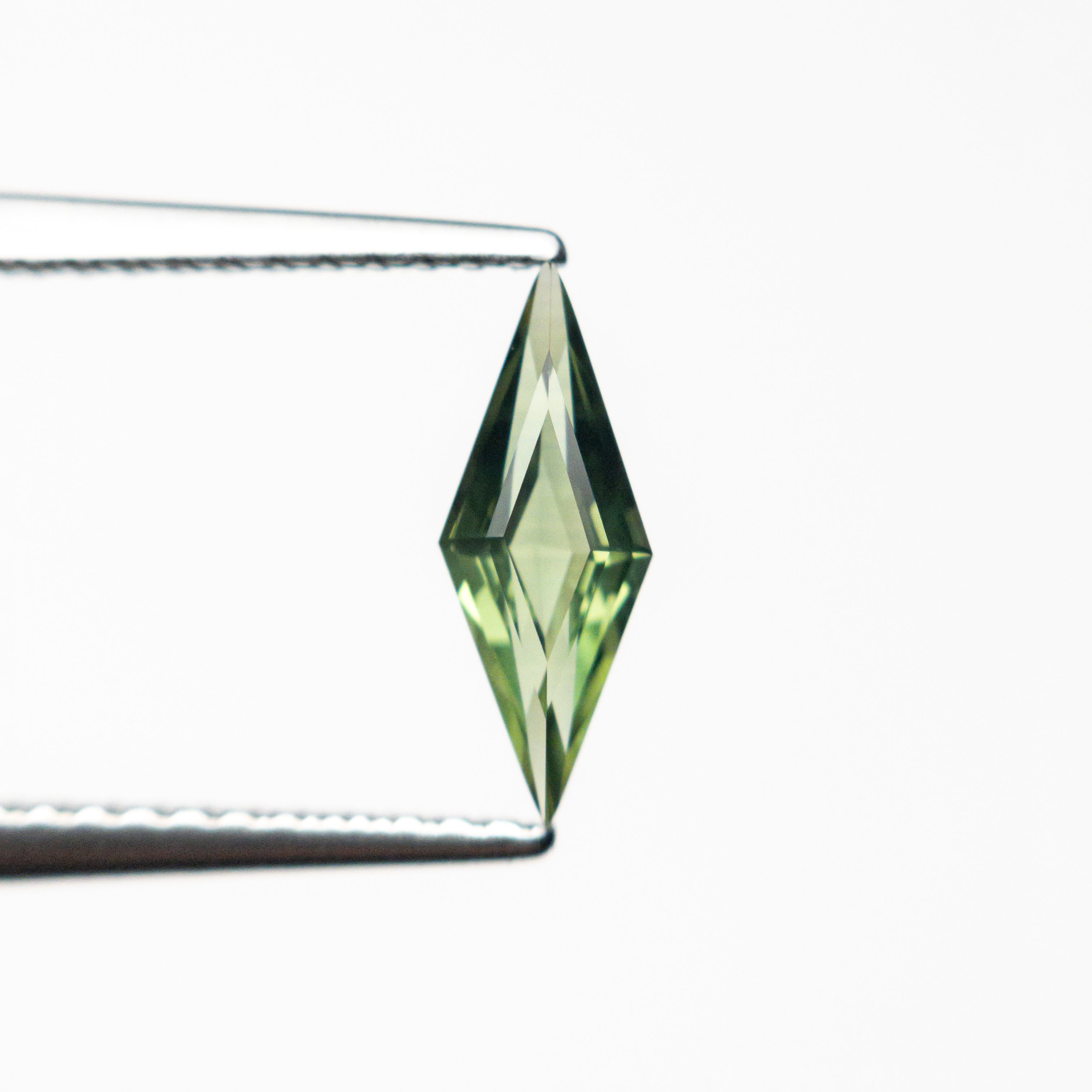 0.51ct 9.97x3.79x2.39mm Lozenge Step Cut Sapphire 25740-11-Staghead Designs