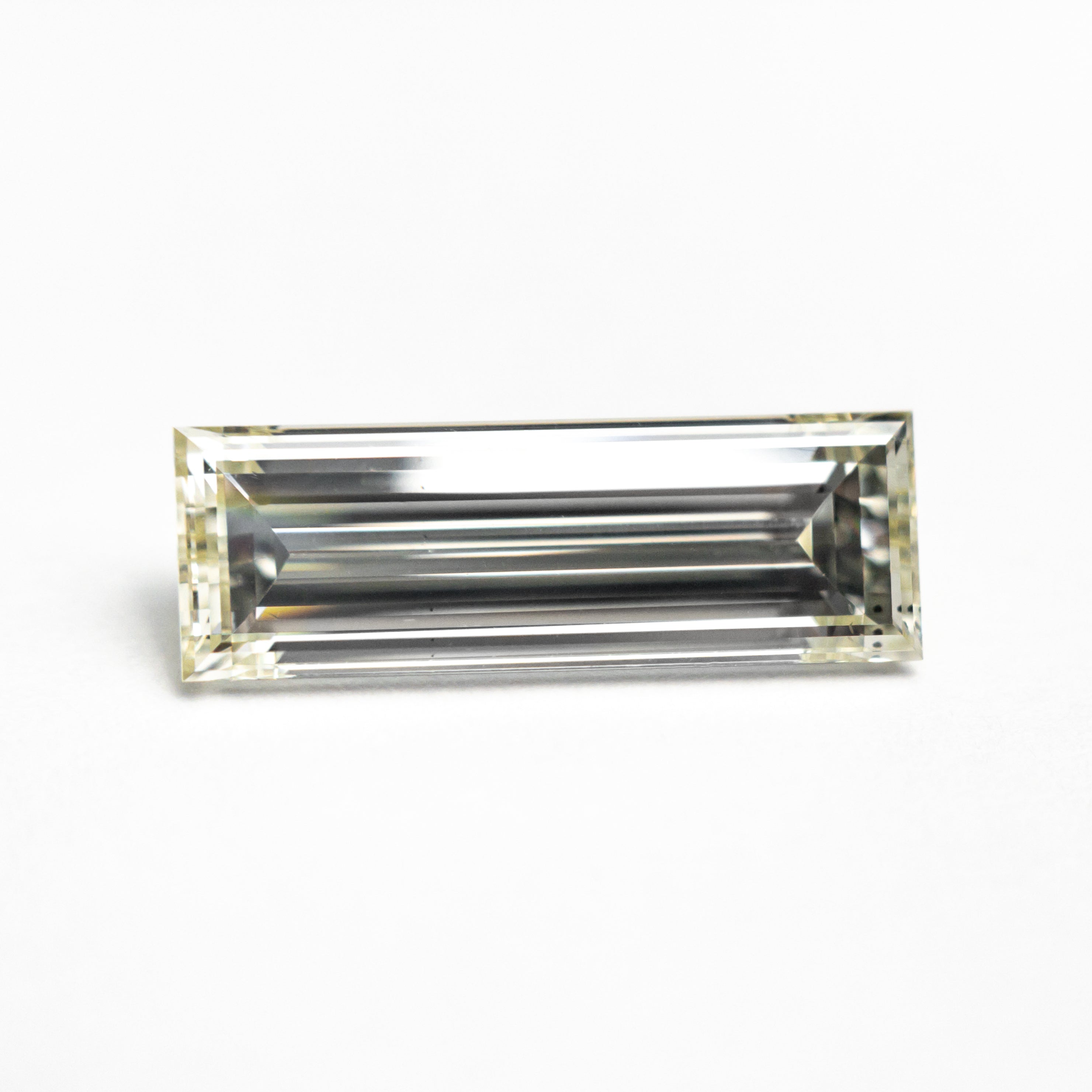 1.52ct 12.21x4.16x2.86mm VS2 O-P Baguette Step Cut 26124-01-Staghead Designs