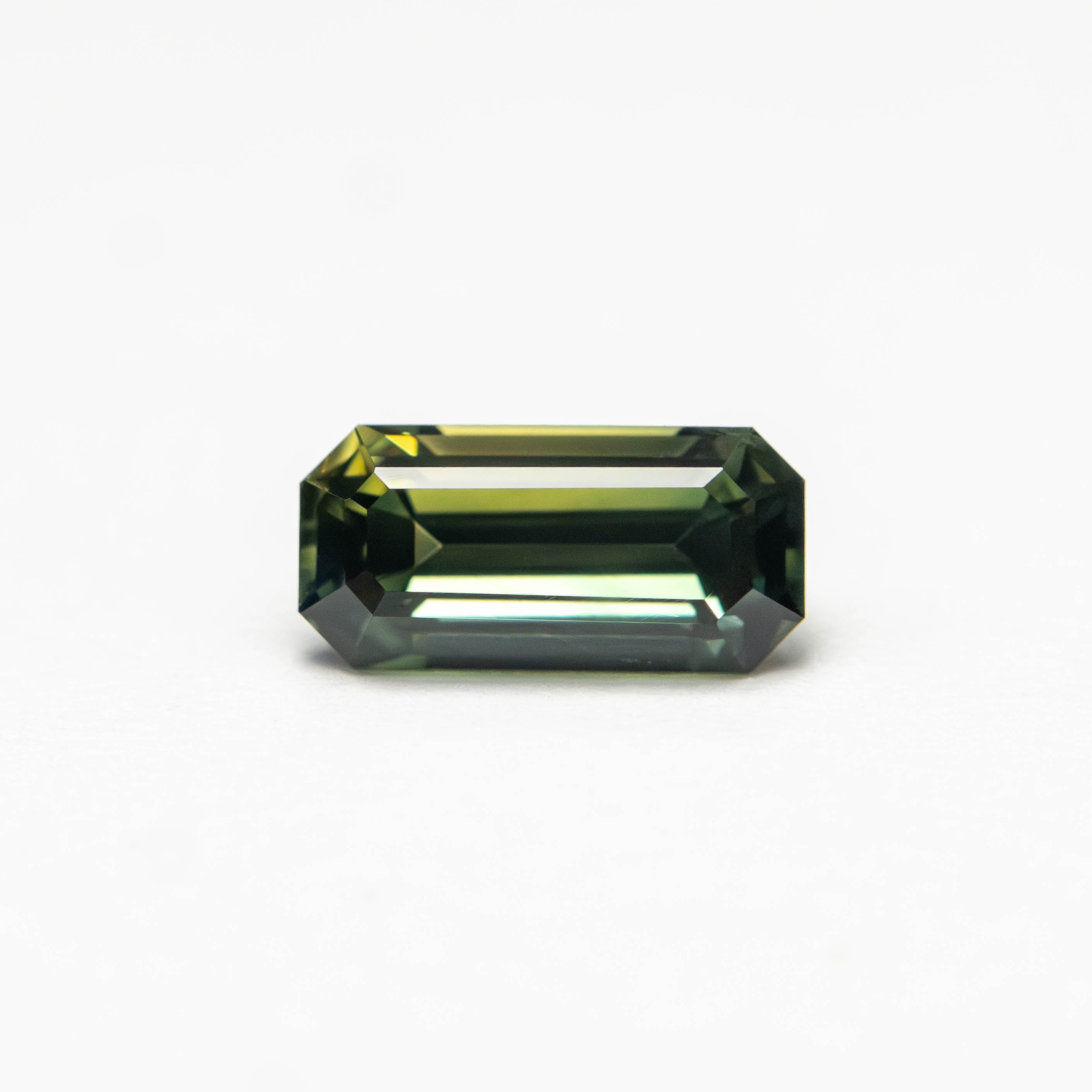 0.82ct 7.17x3.48x3.18mm Cut Corner Rectangle Step Cut Sapphire 27336-57-Staghead Designs
