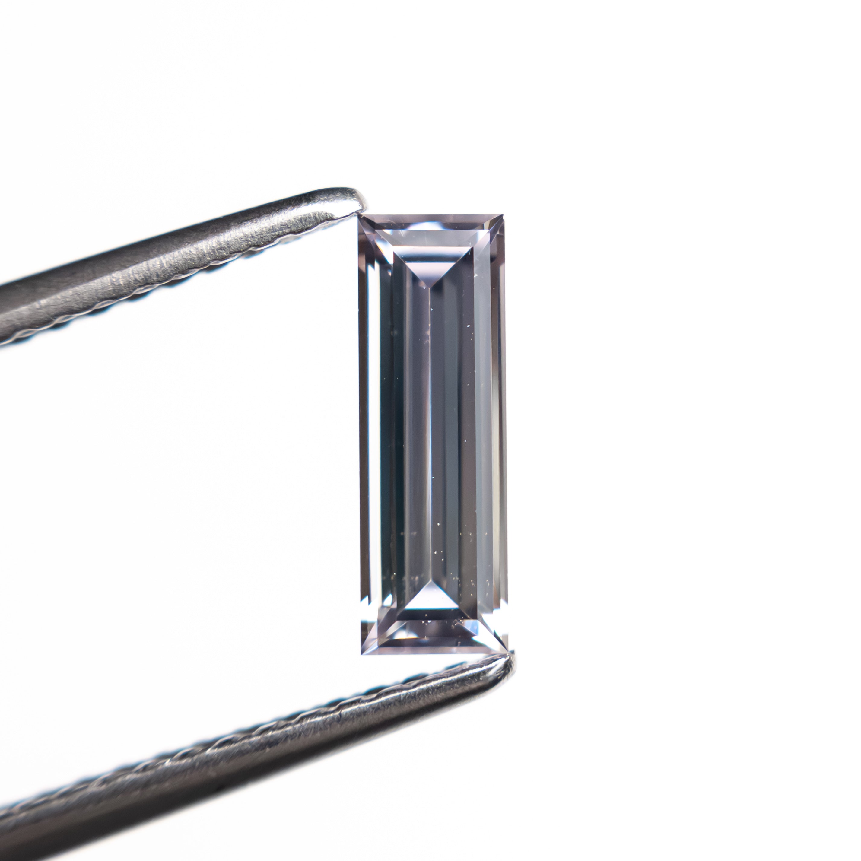 0.63ct 8.99x3.02x2.04mm Baguette Step Cut Sapphire 27720-02-Staghead Designs