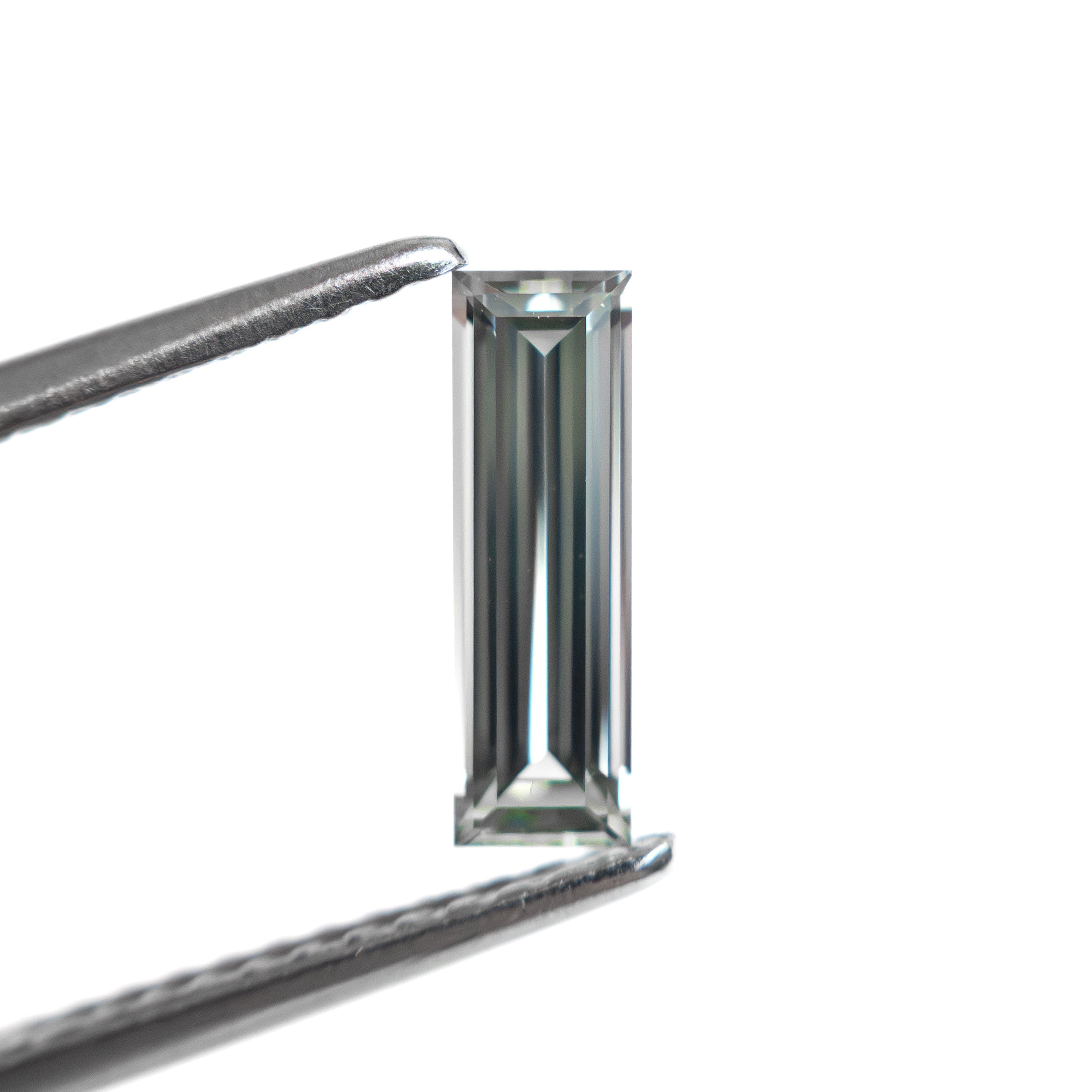 0.59ct 9.05x2.80x2.00mm Baguette Step Cut Sapphire 27720-03-Staghead Designs