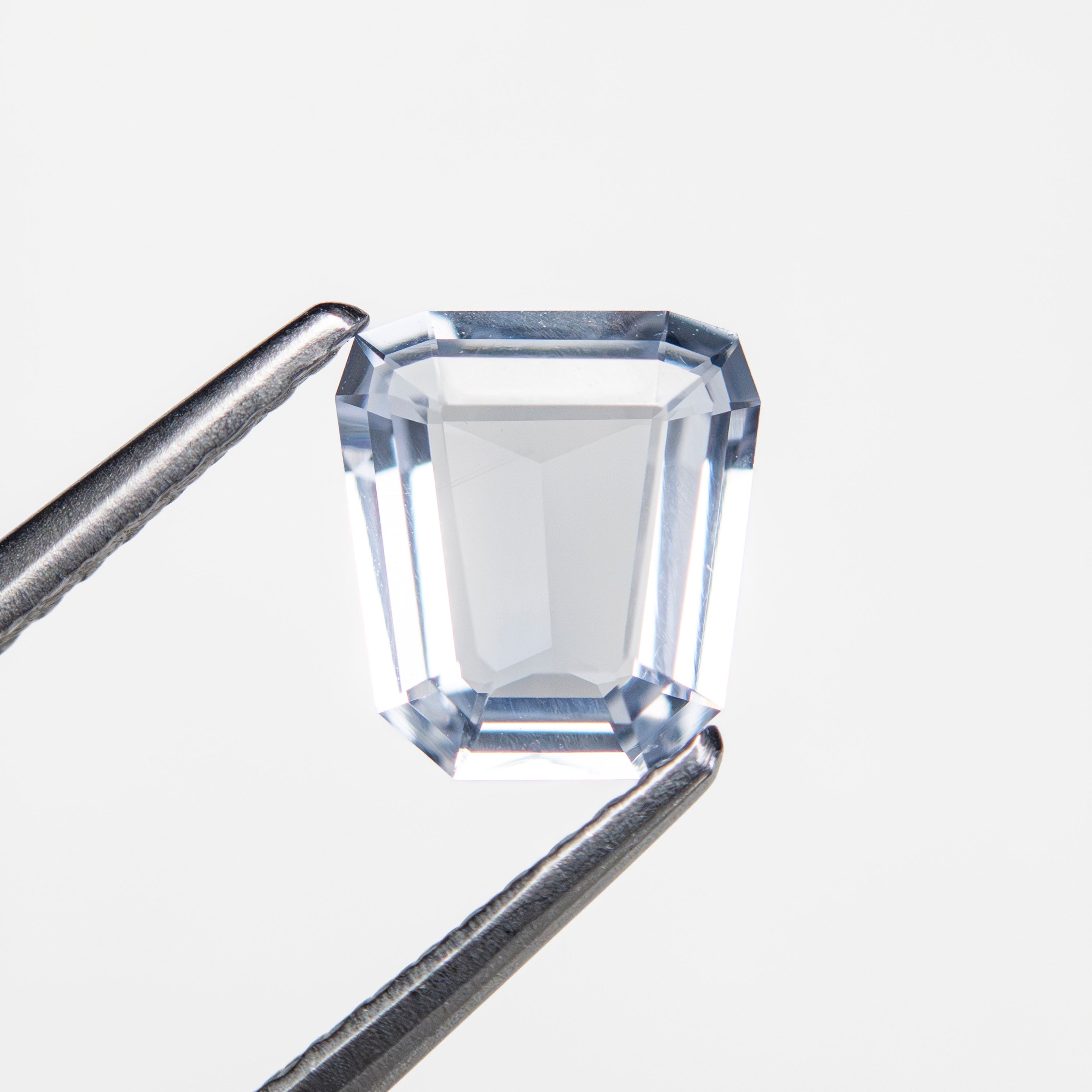 1.12ct 6.95x6.31x2.41mm Trapezoid Step Cut Sapphire 27740-17-Staghead Designs