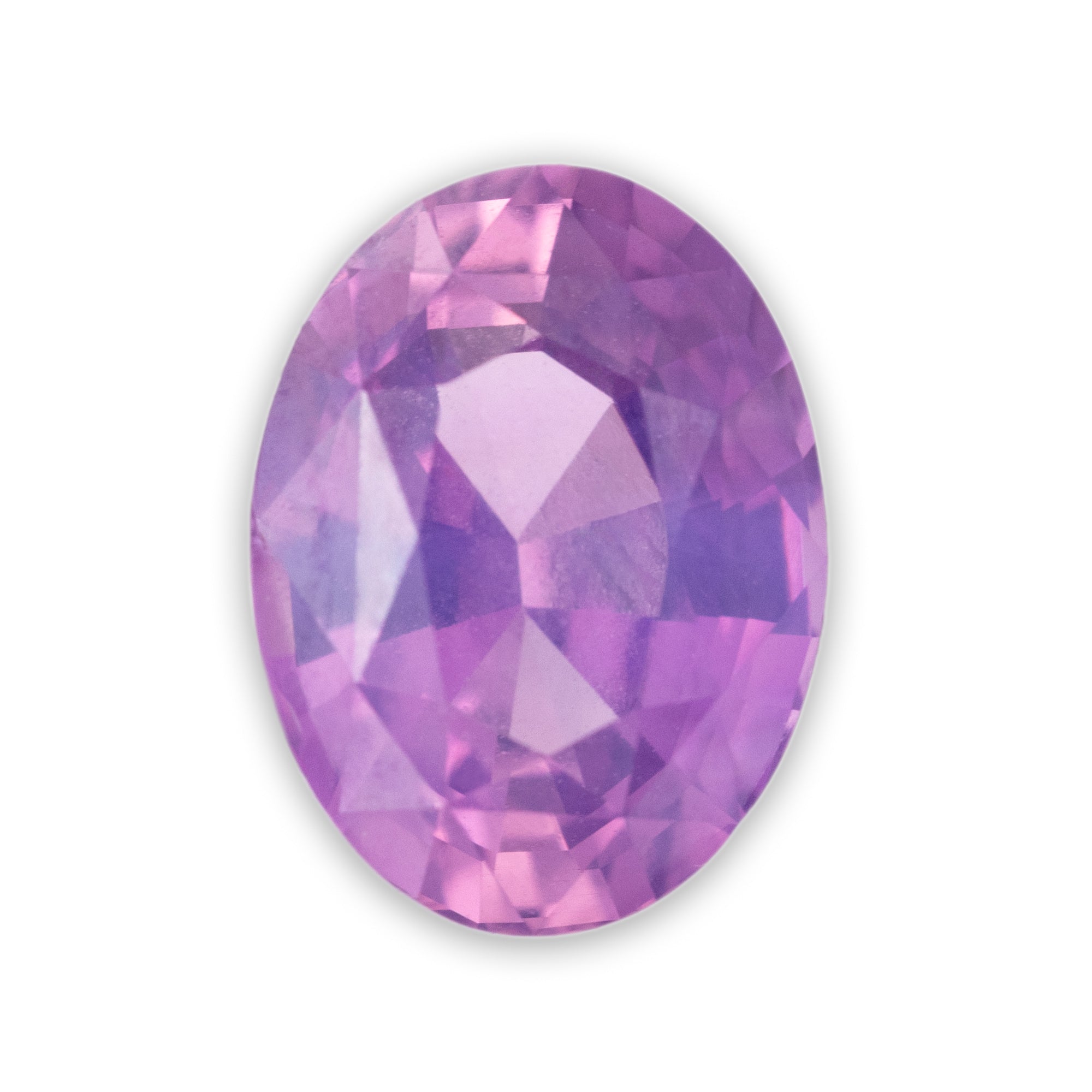Faceted purple gemstone on a white background
