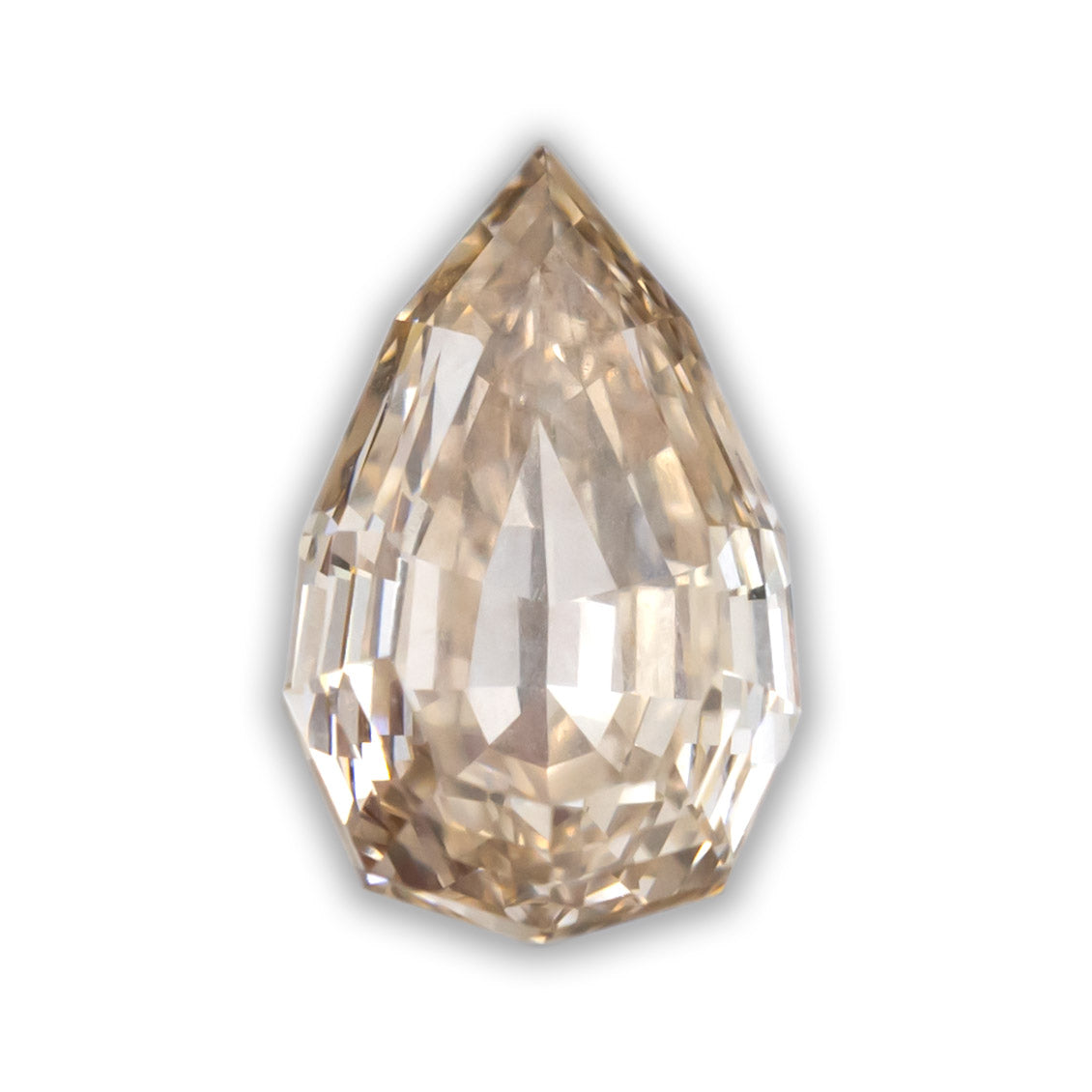 A pear cut diamond with champagne color on a white background
