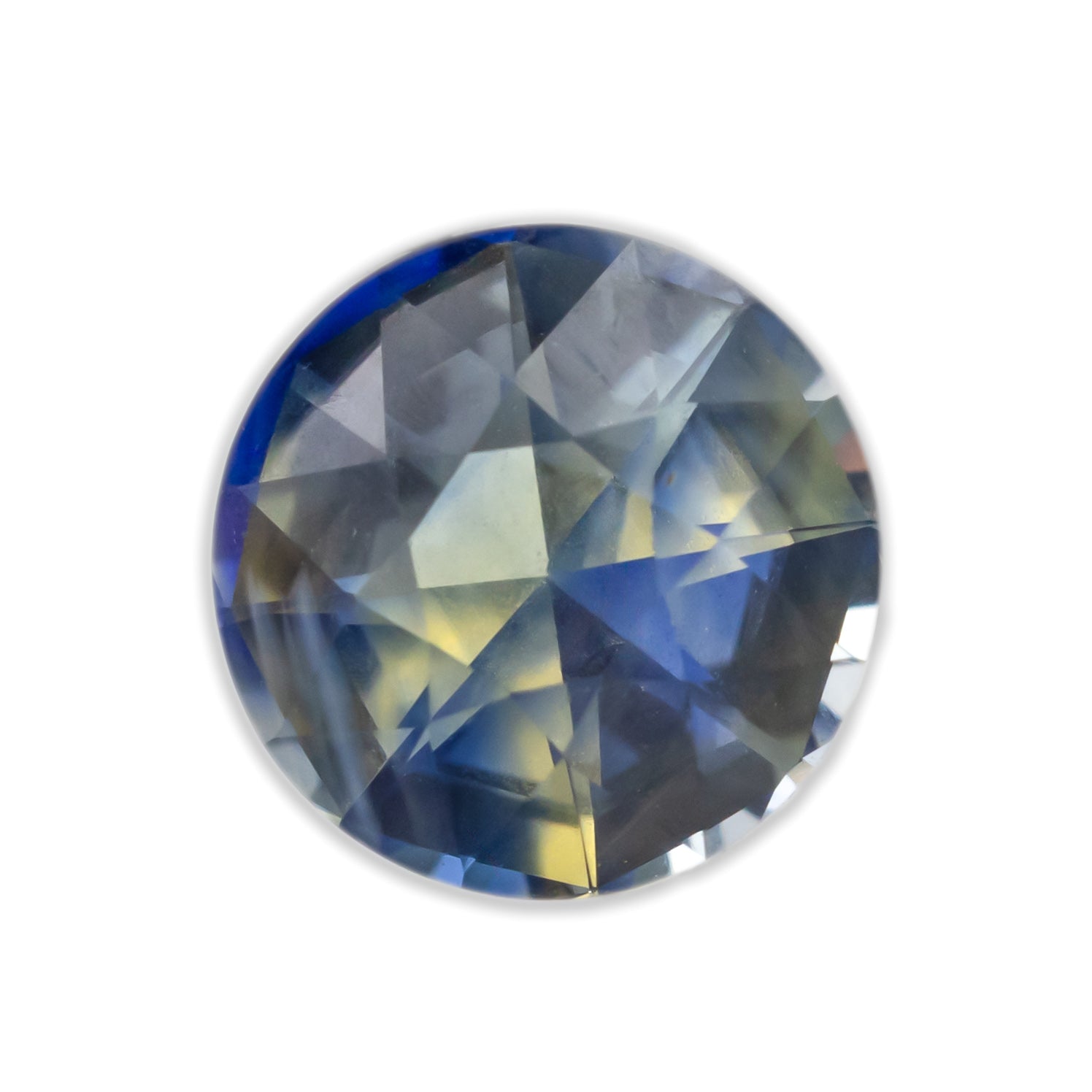 A round sapphire with blue yellow parti-color on a white backgorund
