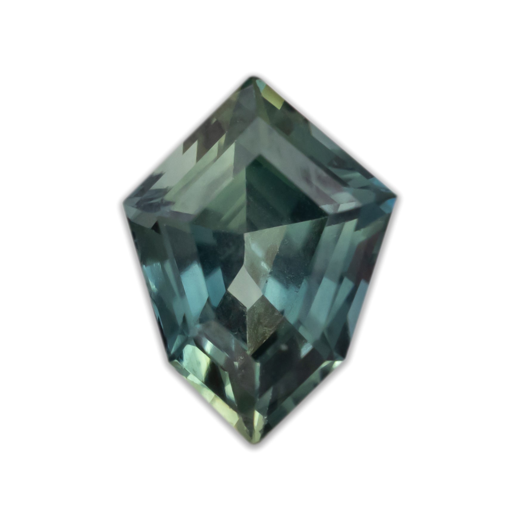 Shield cut green sapphire on white background
