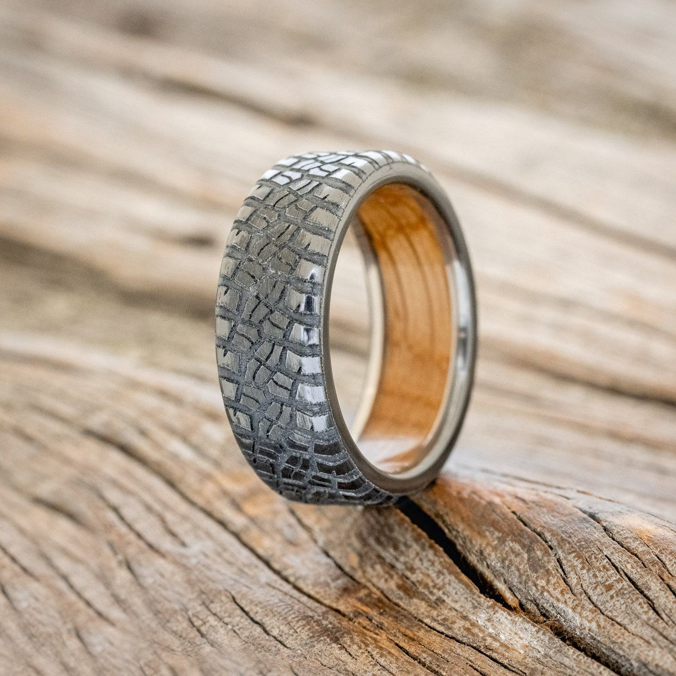"PARCEL" - CUSTOM EMBOSSED TIRE TREAD WEDDING RING WITH A WHISKEY BARREL LINING-1