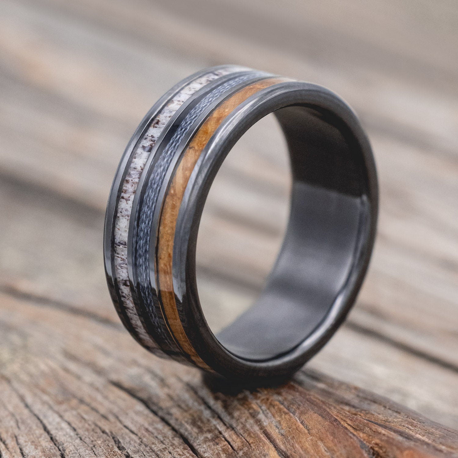 "Rio" - men's wedding ring featuring 3 channels with antler, grey fishing line & whiskey barrel oak inlays