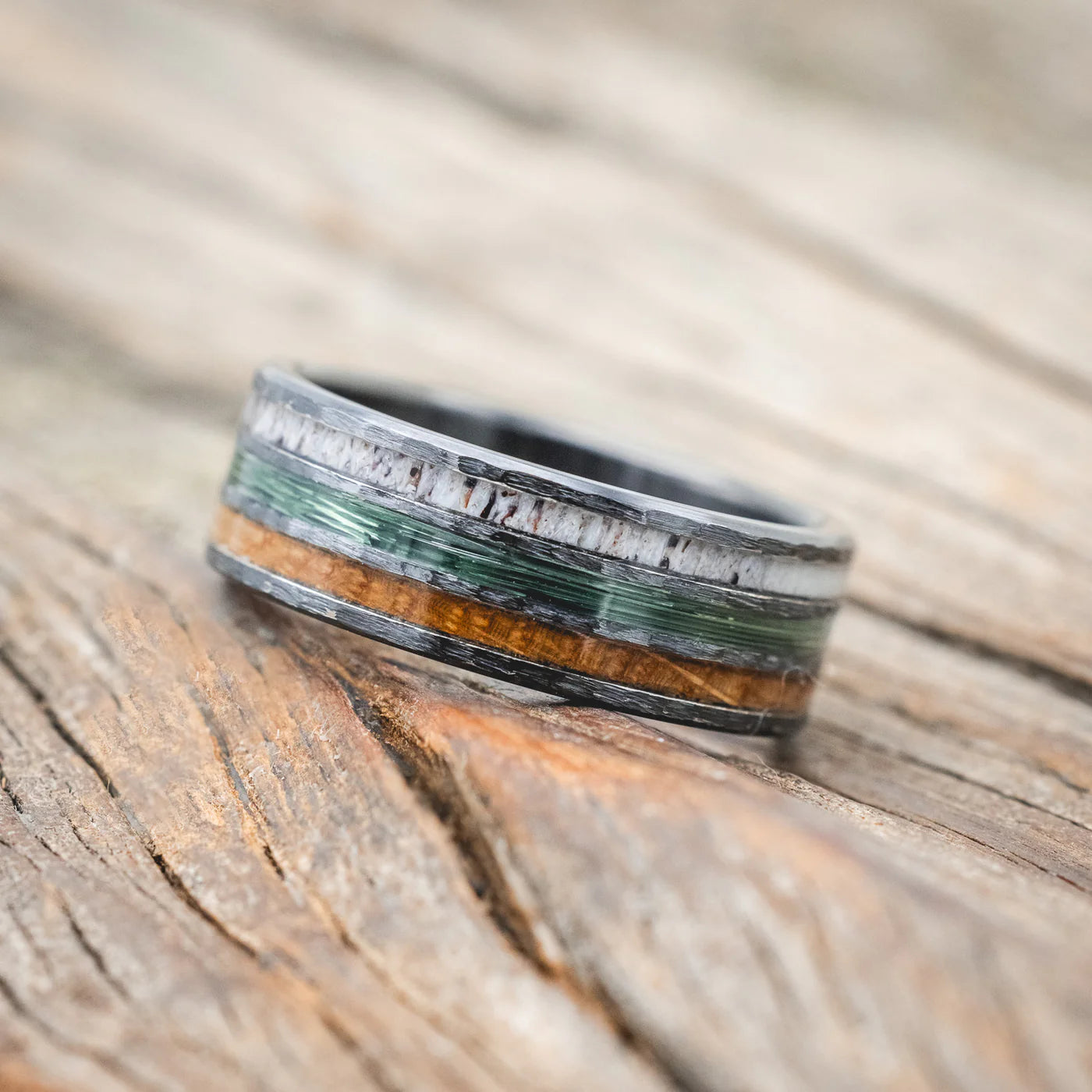 "RIO" - ANTLER, GREEN MONO FISHING LINE, AND WHISKEY BARREL OAK WEDDING BAND WITH A HAMMERED FINISH - BLACK ZIRCONIUM - SIZE 11 1/2-Staghead Designs