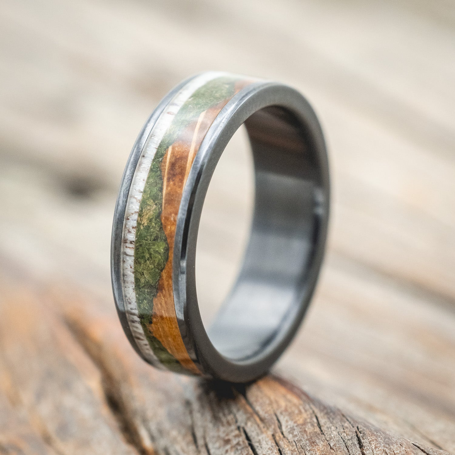 "Voyager" - men's wedding ring featuring moss-filled mountain engraving with whiskey barrel oak & antler inlays