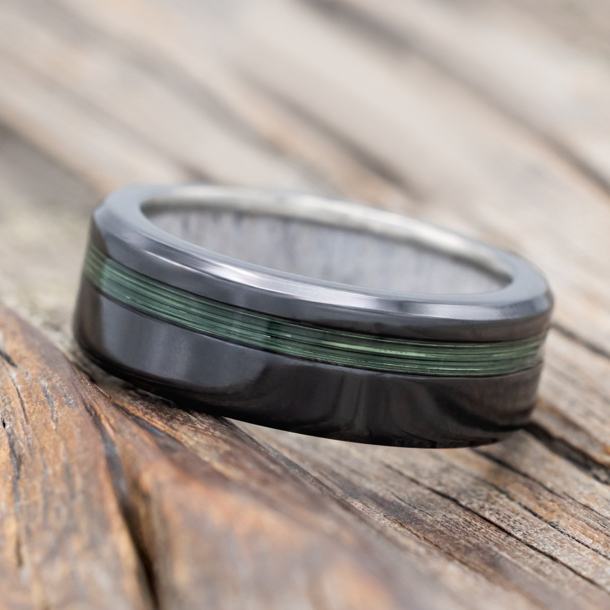 Black zirconium ring with green fishing line ring and antler lining 