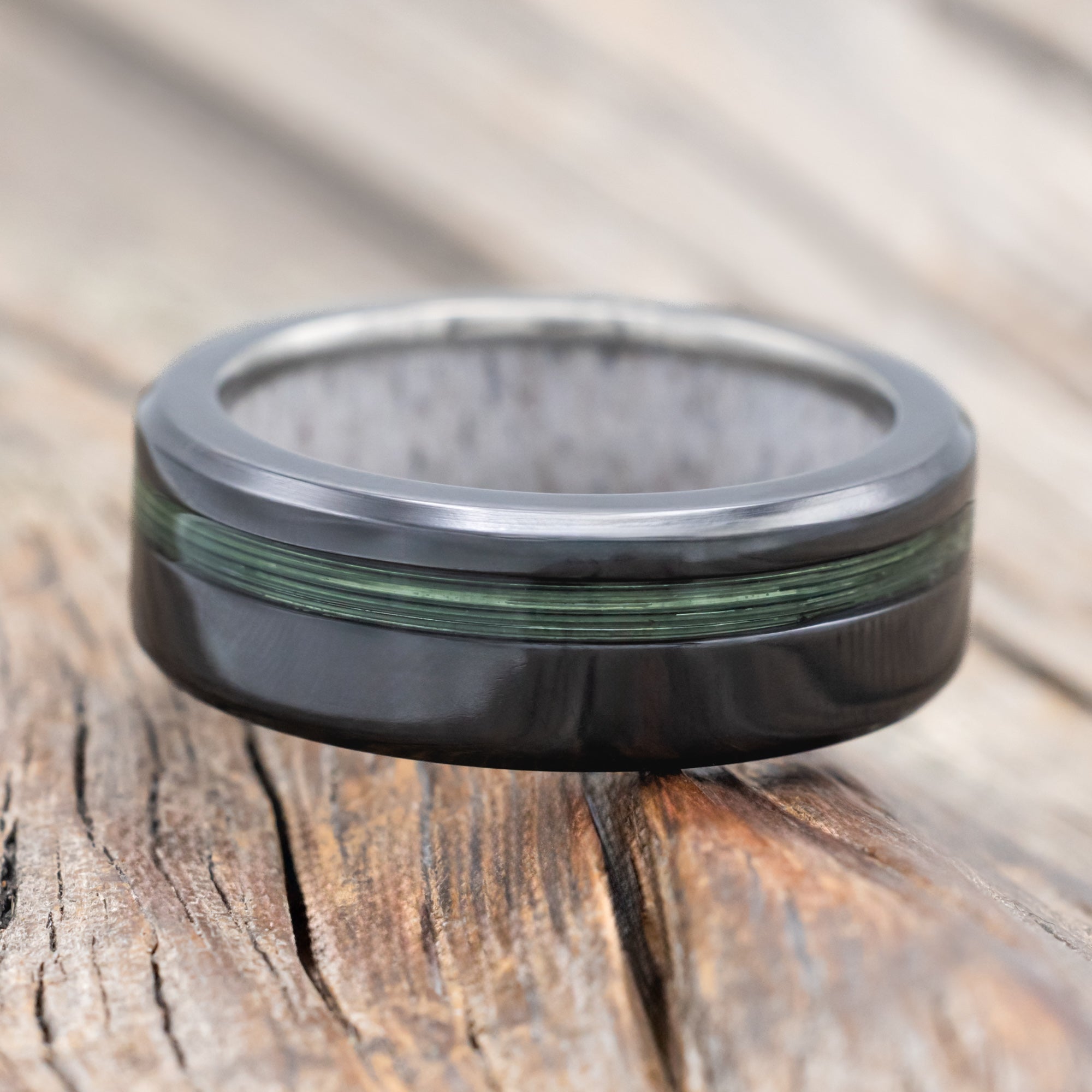 Black zirconium ring with green fishing line ring and antler lining 