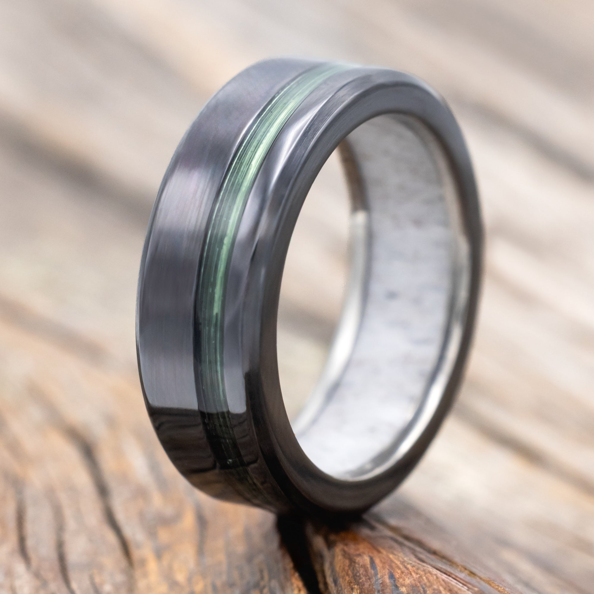 Black zirconium ring with green fishing line ring and antler lining 