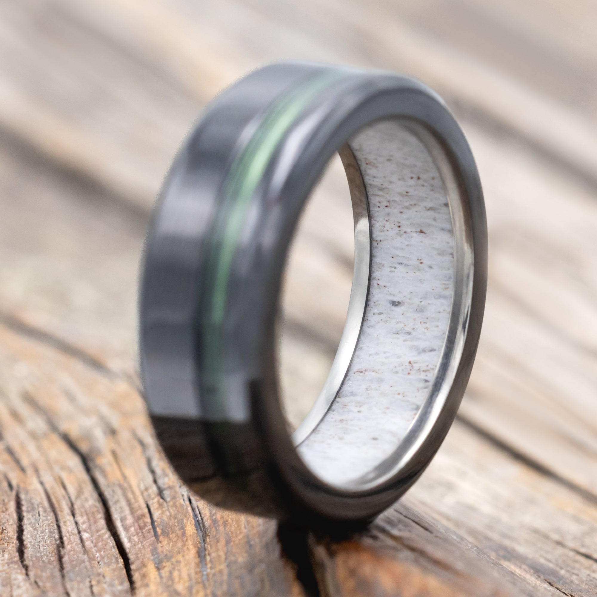 Black zirconium ring with green fishing line ring and antler lining 