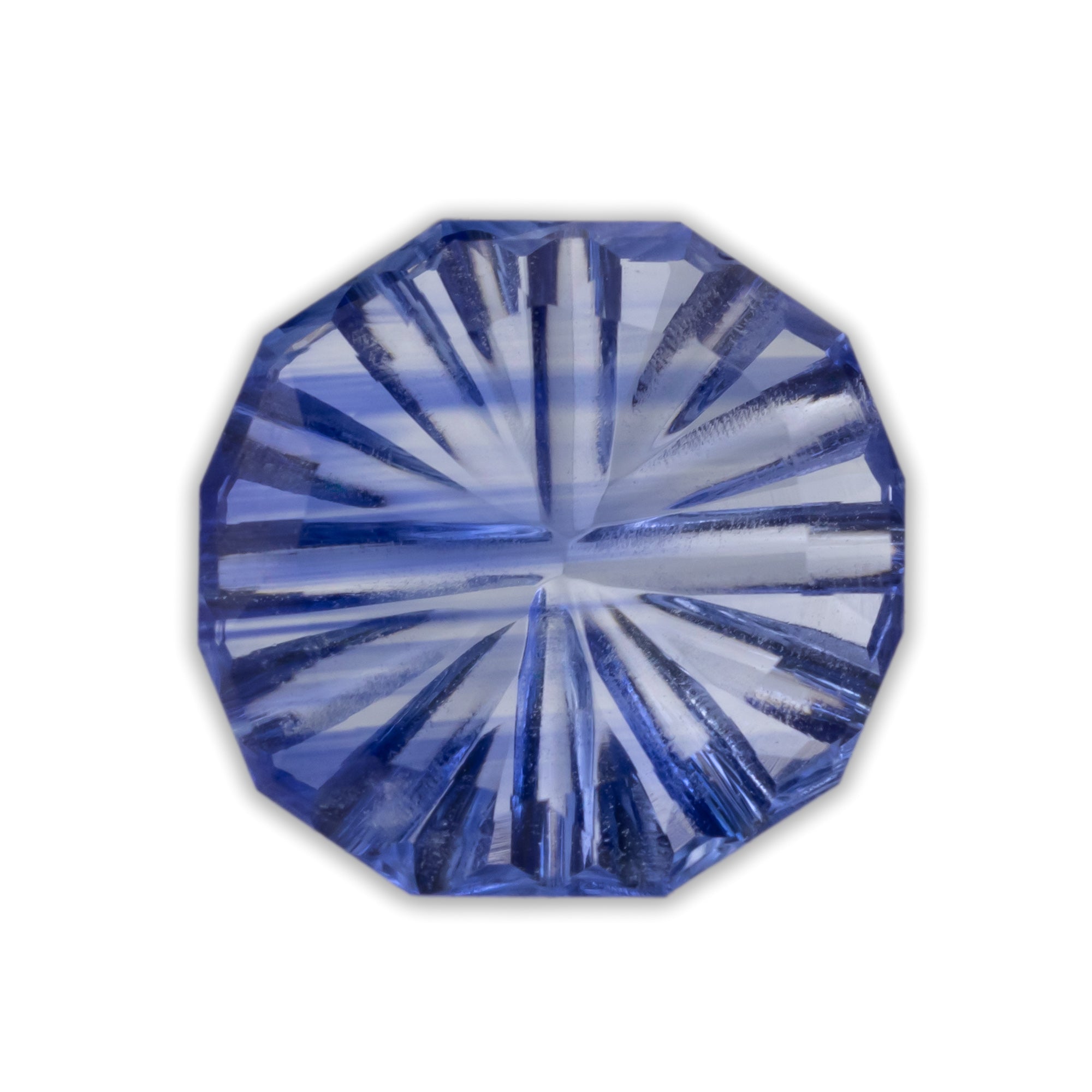 Faceted cornflower blue sapphire on a white background