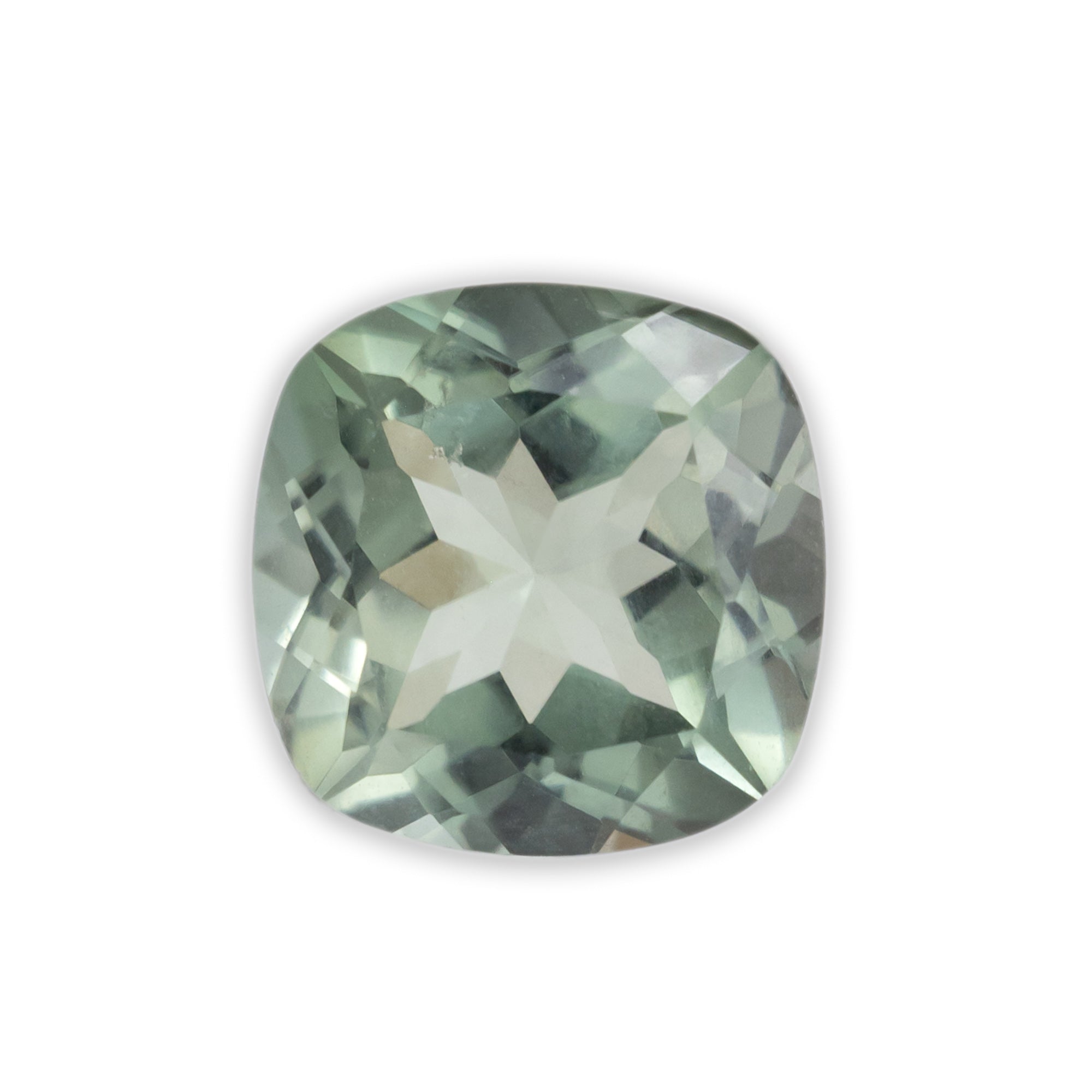 Cushion cut tourmaline with sage green color on a white background